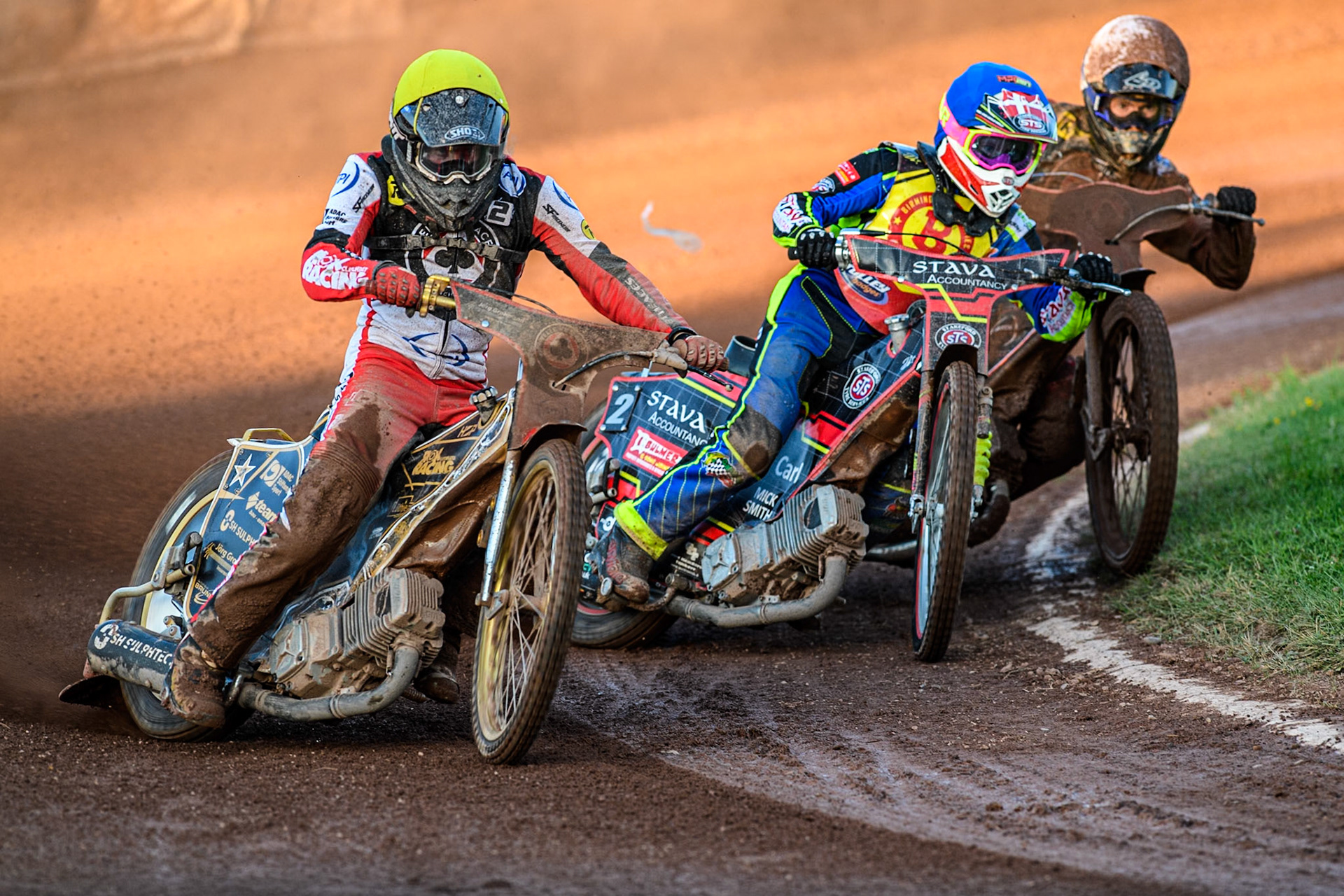 Belle Vue Aces' Norick Blodorn in Yellow rides outside Birmingham Brummies' Michael Palm Toft in Blue and Belle Vue Aces' Brady Kurtz in White during the Rowe Motor Oil Premiership match between Birmingham Brummies and Belle Vue Aces at Perry Bar Stadium, Birmingham on Monday 29th July 2024. (Photo: Ian Charles | MI News)