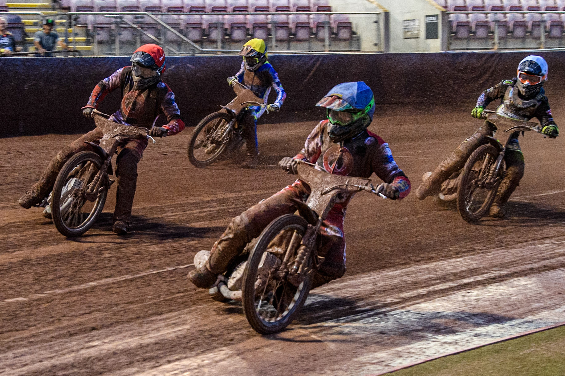 Belle Vue Colts' William Cairns  in Blue rides inside Belle Vue Colts' Matt Marson  in Red, and leading Oxford Chargers' Max Perry  in White and Oxford Chargers' Senna Summers  in Yellow during the WSRA National Development League match between Belle Vue Colts and Oxford Chargers at the National Speedway Stadium, Manchester on Friday 2nd August 2024. (Photo: Ian Charles | MI News)
