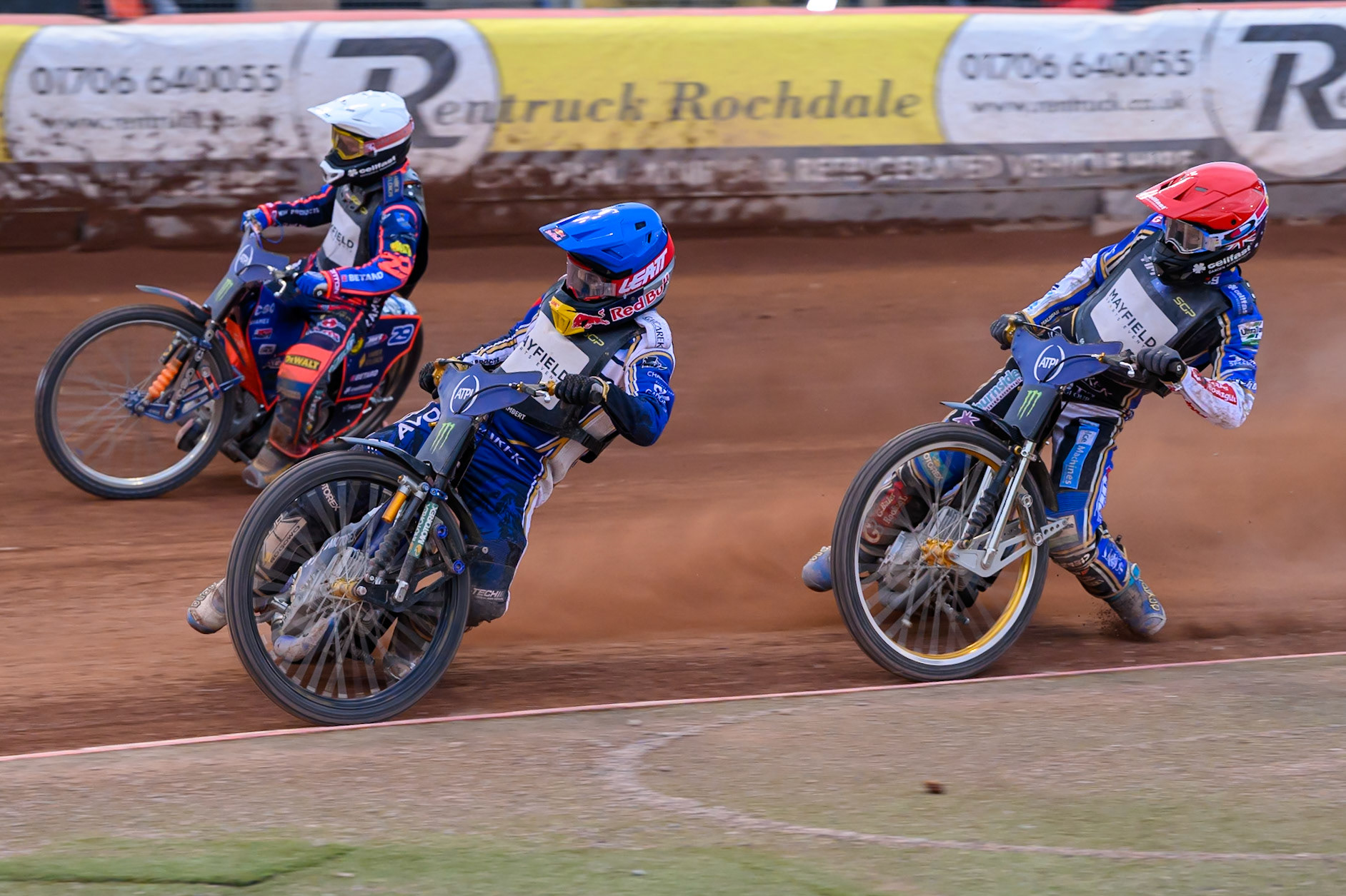 Robert Lambert (505) of Great Britain in Blue rides inside Andzejs Lebedevs (29) of Latvia in White with Jason Doyle (69) of Australia in Red behind during the ATPI  FIM Speedway GP of Manchester at the National Speedway Stadium, Manchester on Friday 5th June 2026. (Photo: Ian Charles | MI News)