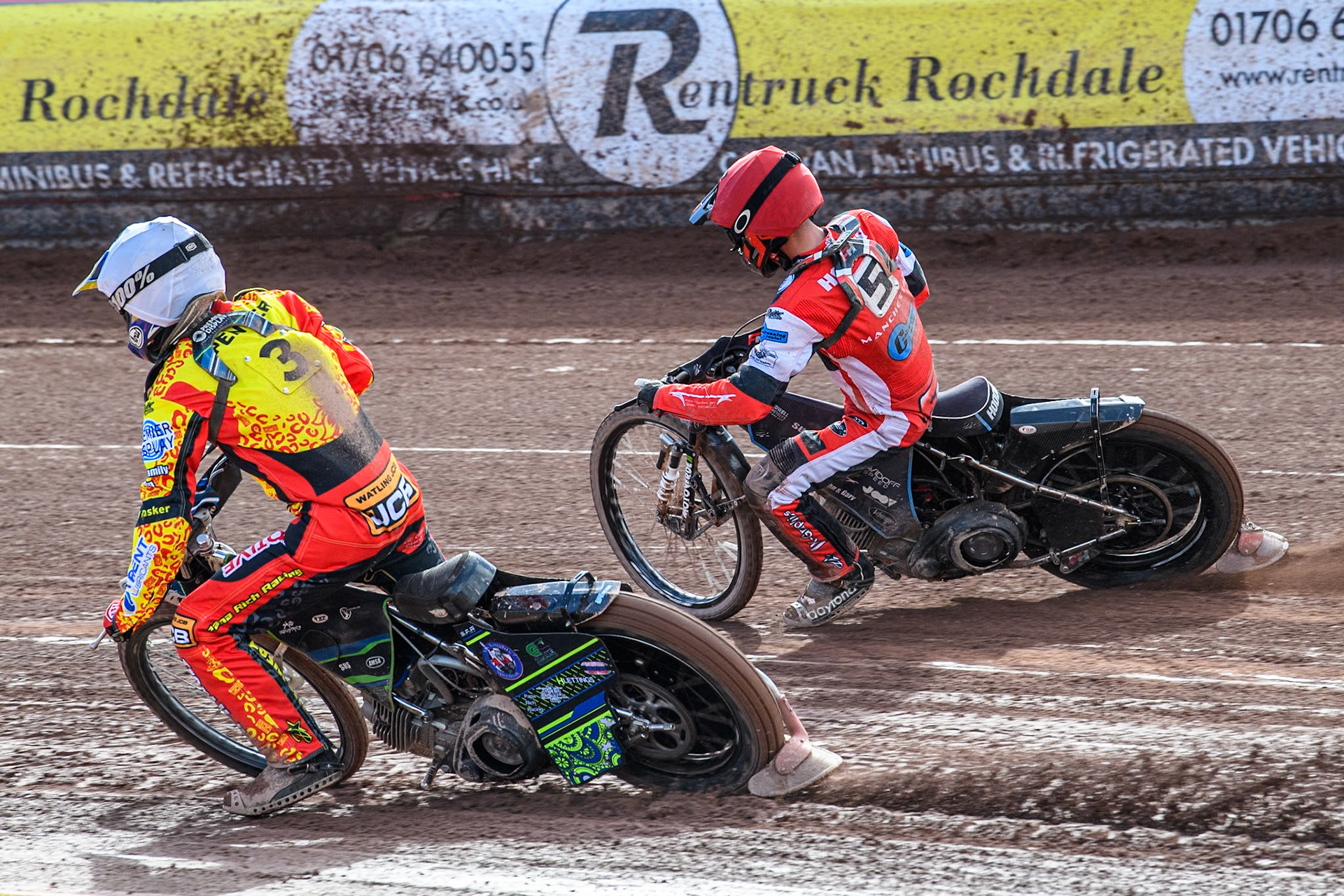 Leicester Lion Cubs' Tom Spencer (White) inside Belle Vue Colts' Freddy Hodder (Red) during the WSRA National Development League match between Belle Vue Colts and Leicester Lion Cubs at the National Speedway Stadium, Manchester on Friday 29th March 2024. (Photo: Ian Charles | MI News)