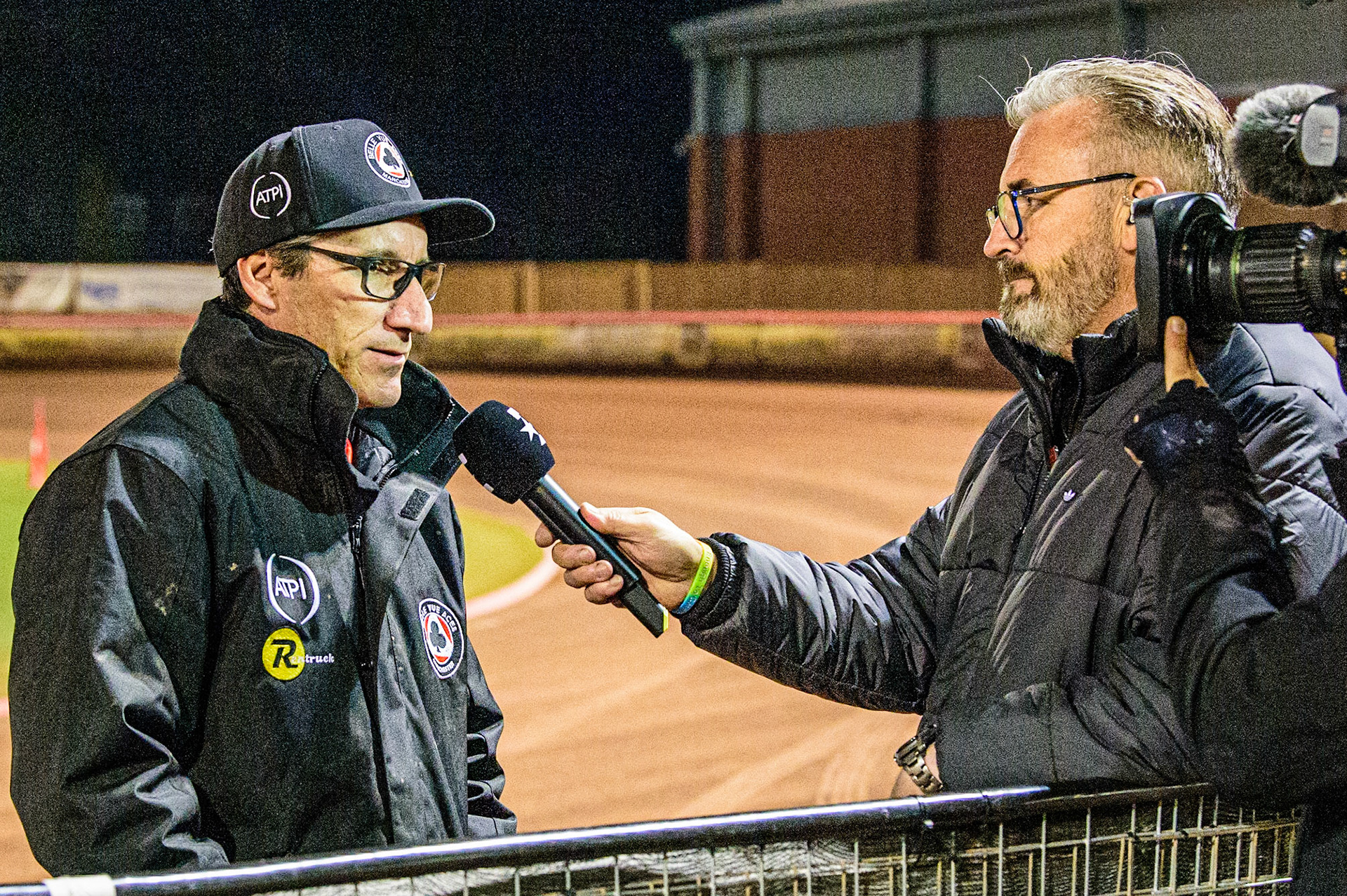 Mark Lemon, Manager of Belle Vue ATPI Aces  is interviewed by Steve Brandon from Eurosport after Charles Wright’s fall during the SGB Premiership Grand Final 1st leg between Belle Vue Aces and Sheffield Tigers at the National Speedway Stadium, Manchester on Monday 10th October 2022. (Credit: Ian Charles | MI News)