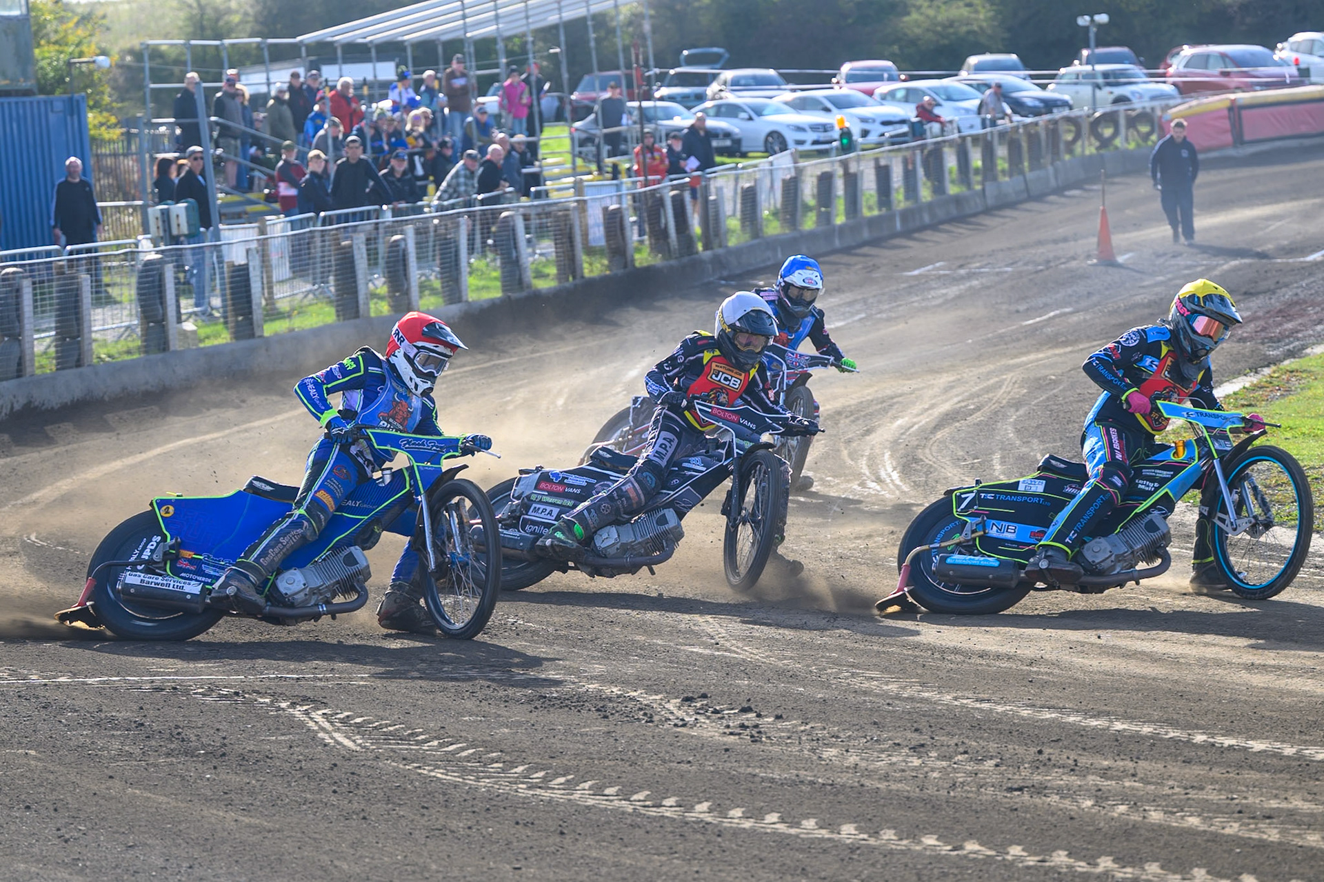Eli Meadows  of Leicester Lion Cubs  in Yellow leading Seth Norman of Leicester Lion Cubs   in White and Arran Butcher of Buxton Bulls   in Red  with Jack Shimelt of Buxton Bulls  in Blue  behind during the WSRA National Development League match between Buxton Bulls and Leicester Lion Cubs at Hi-Edge Speedway, Buxton on Sunday 4th October 2026. (Photo: Ian Charles | MI News)