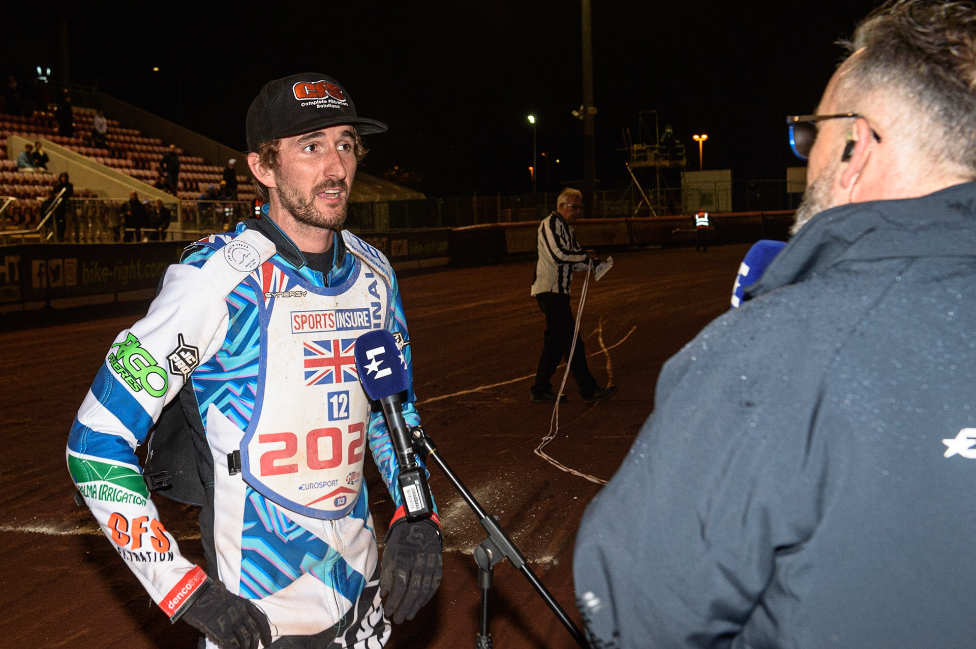 MANCHESTER, UK. AUGUST 16TH   Adam Ellis  is interviewed by Steve Brandon from Eurosport during the Sports Insure British Speedway Finals at the National Speedway Stadium, Manchester on Monday 16th August 2021. (Credit: Ian Charles | MI News)