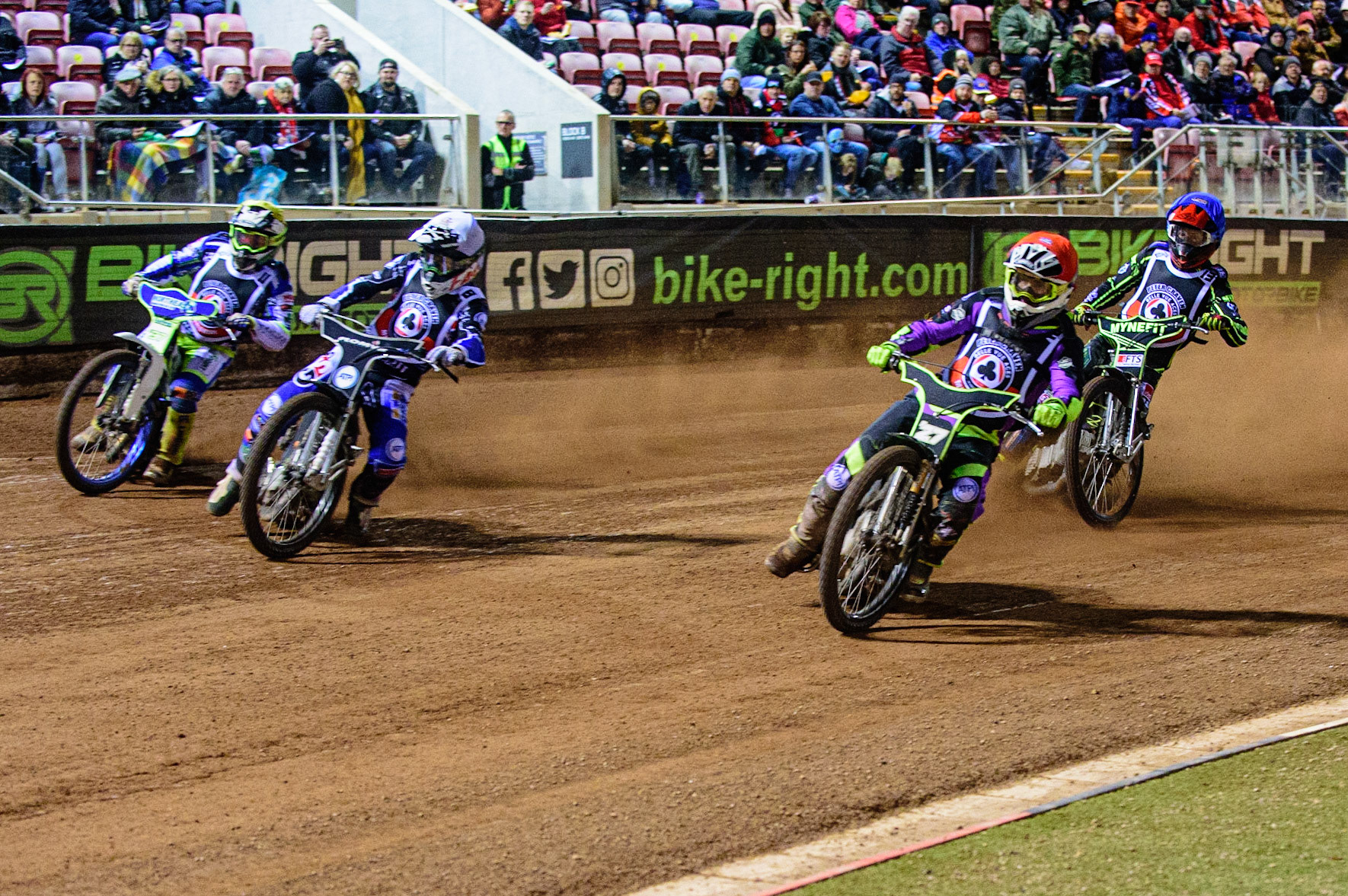 MANCHESTER, UK. OCT 23RD  Tom Brennan  (Red) inside Dan Bewley  (White) and Chris Harris  (Yellow) with Jye Etheridge  (Blue) behind during the Peter Craven Memorial Trophy event at the National Speedway Stadium, Manchester on Saturday 23rd October 2021. (Credit: Ian Charles | MI News)