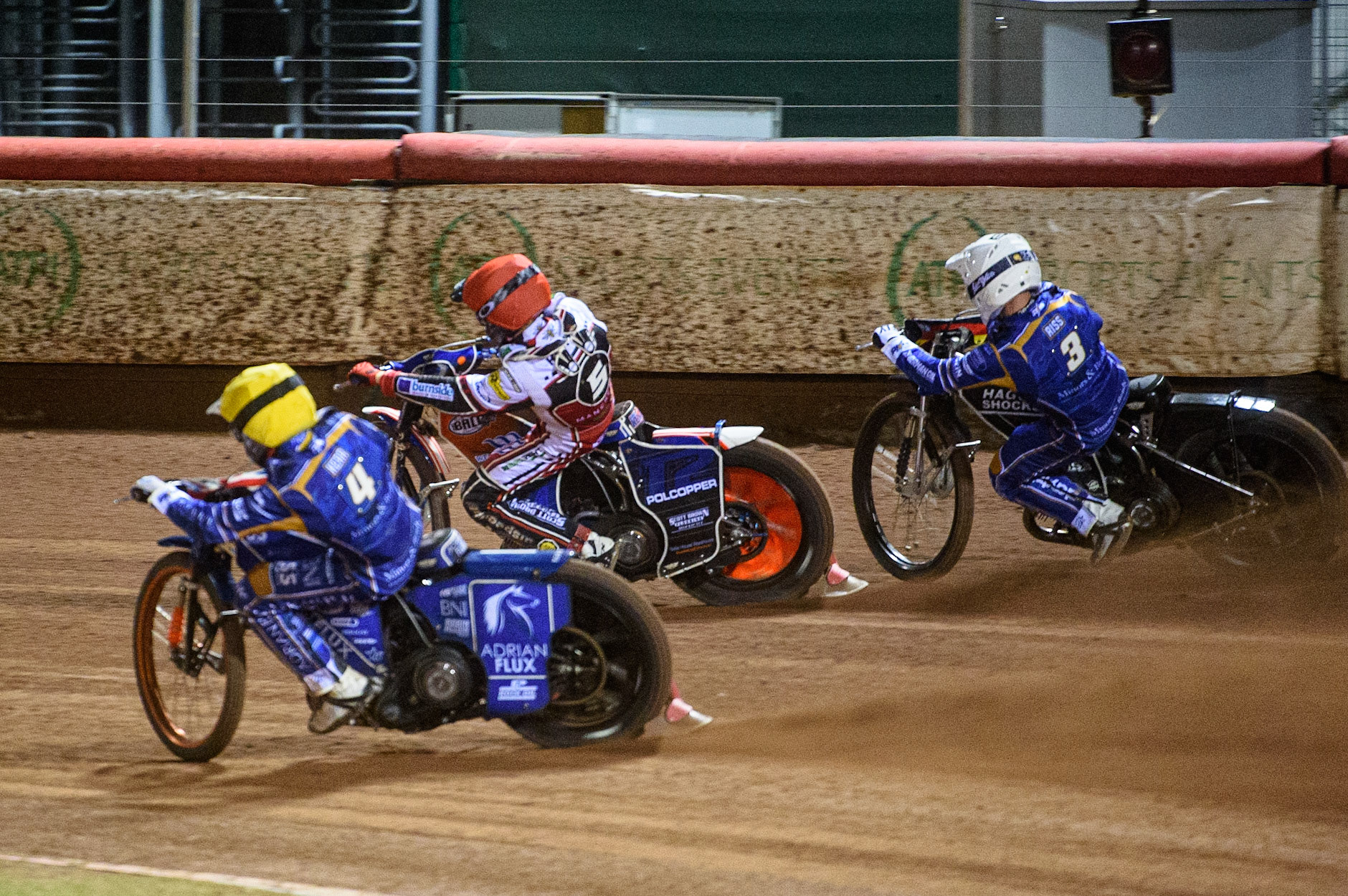 MANCHESTER, UK. SEPT 13TH  Brady Kurtz  (Red) splits Erik Riss  (White) and Lewis Kerr  (Yellow) during the SGB Premiership match between Belle Vue Aces and King's Lynn Stars at the National Speedway Stadium, Manchester on Monday 13th September 2021. (Credit: Ian Charles | MI News)