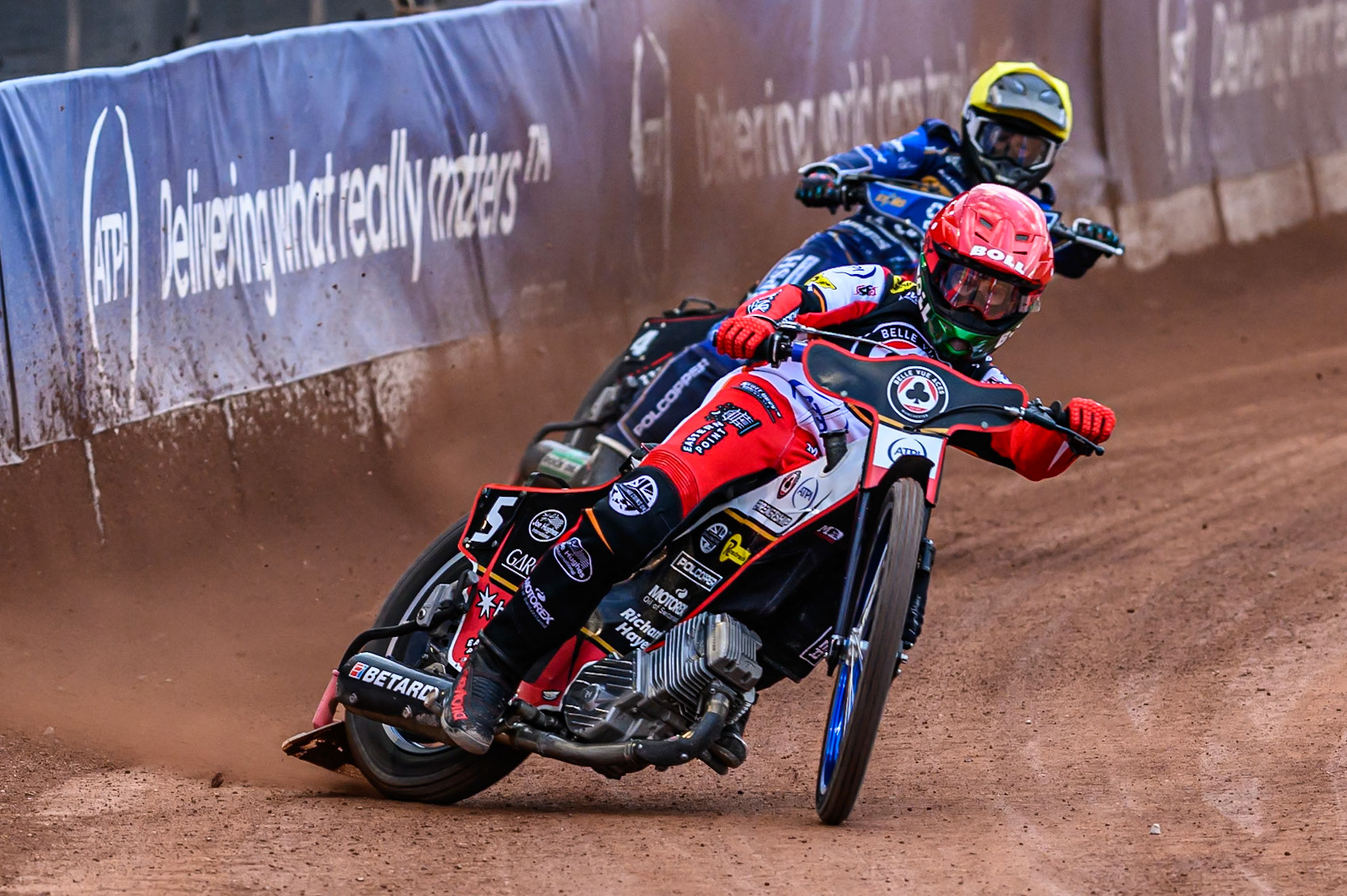 Belle Vue Aces' Brady Kurtz in Red leading Kings Lynn Stars' Ben Cook in Yellow during the Rowe Motor Oil Premiership match between Belle Vue Aces and King's Lynn Stars at the National Speedway Stadium, Manchester on Monday 23rd June 2025. (Photo: Ian Charles | MI News)
