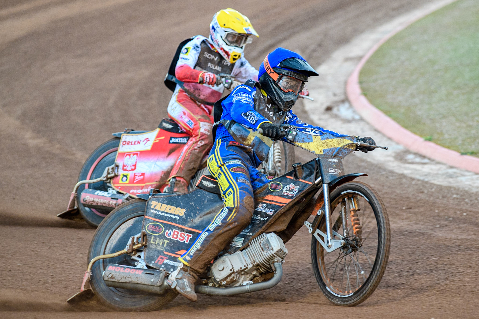 Jacob Thorssell of Sweden in Blue leading Maciej Janowski of Poland in Yellow during the Monster Energy FIM Speedway of Nations Semi-Final 1 at the National Speedway Stadium, Manchester on Tuesday 9th July 2024. (Photo: Ian Charles | MI News)
