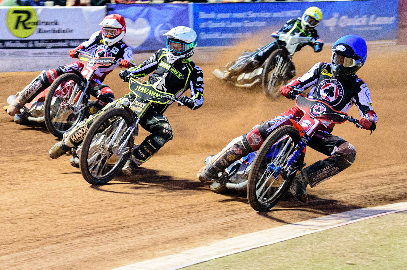 Brady Kurtz (Blue) inside Jason Doyle  (White) and Max Fricke  (Red) with Rohan Tungate  (Yellow) behind during the SGB Premiership match between Belle Vue Aces and Ipswich Witches at the National Speedway Stadium, Manchester on Monday 8th August 2022. (Credit: Ian Charles | MI News)