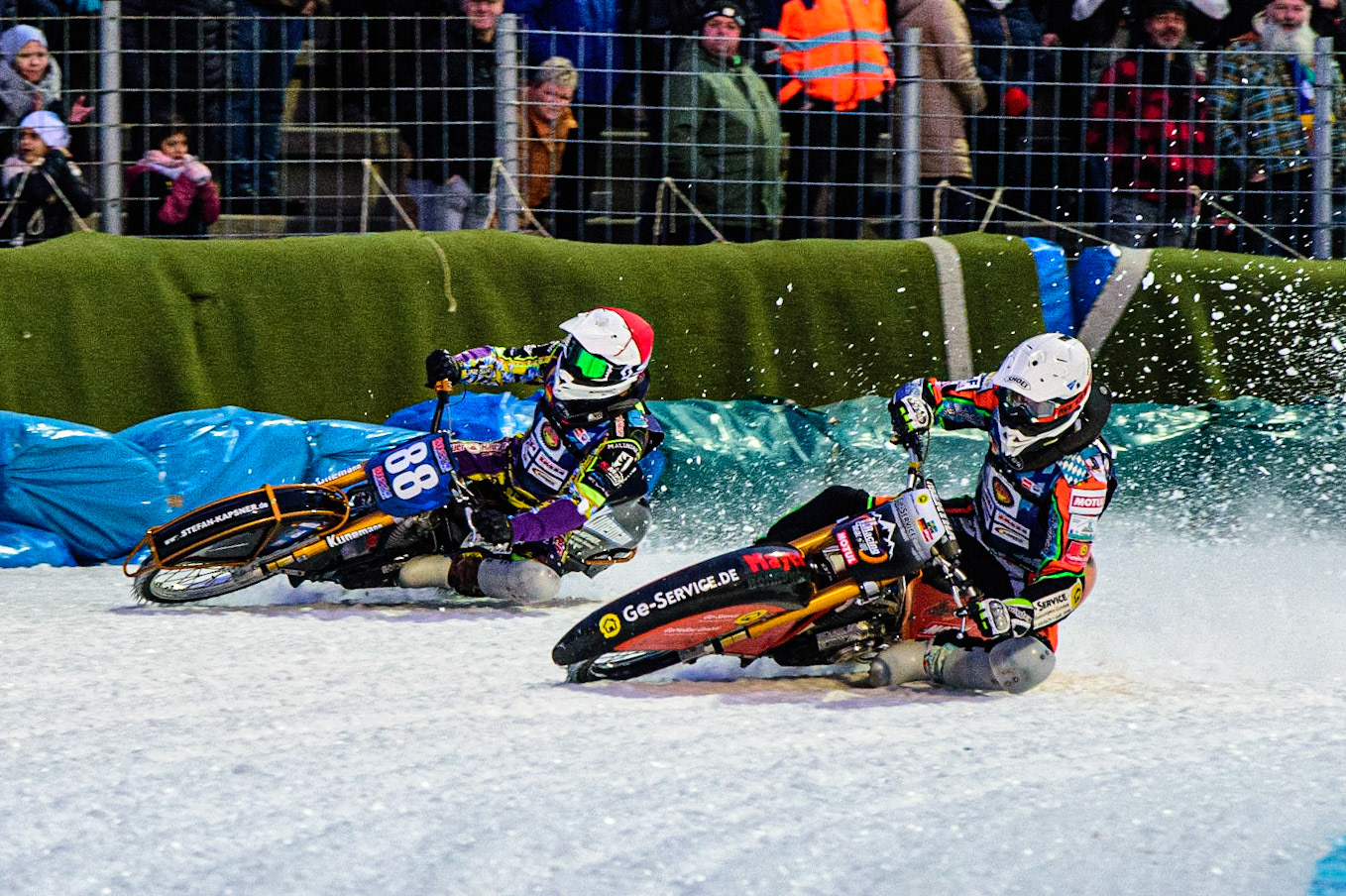 Markus Jell (White) passes Max Neidermaier (Red) on the inside during the German Individual Ice Speedway Championship at Horst-Dohm-Eisstadion, Berlin on Friday 3rd March 2023. (Photo: Ian Charles | MI News)