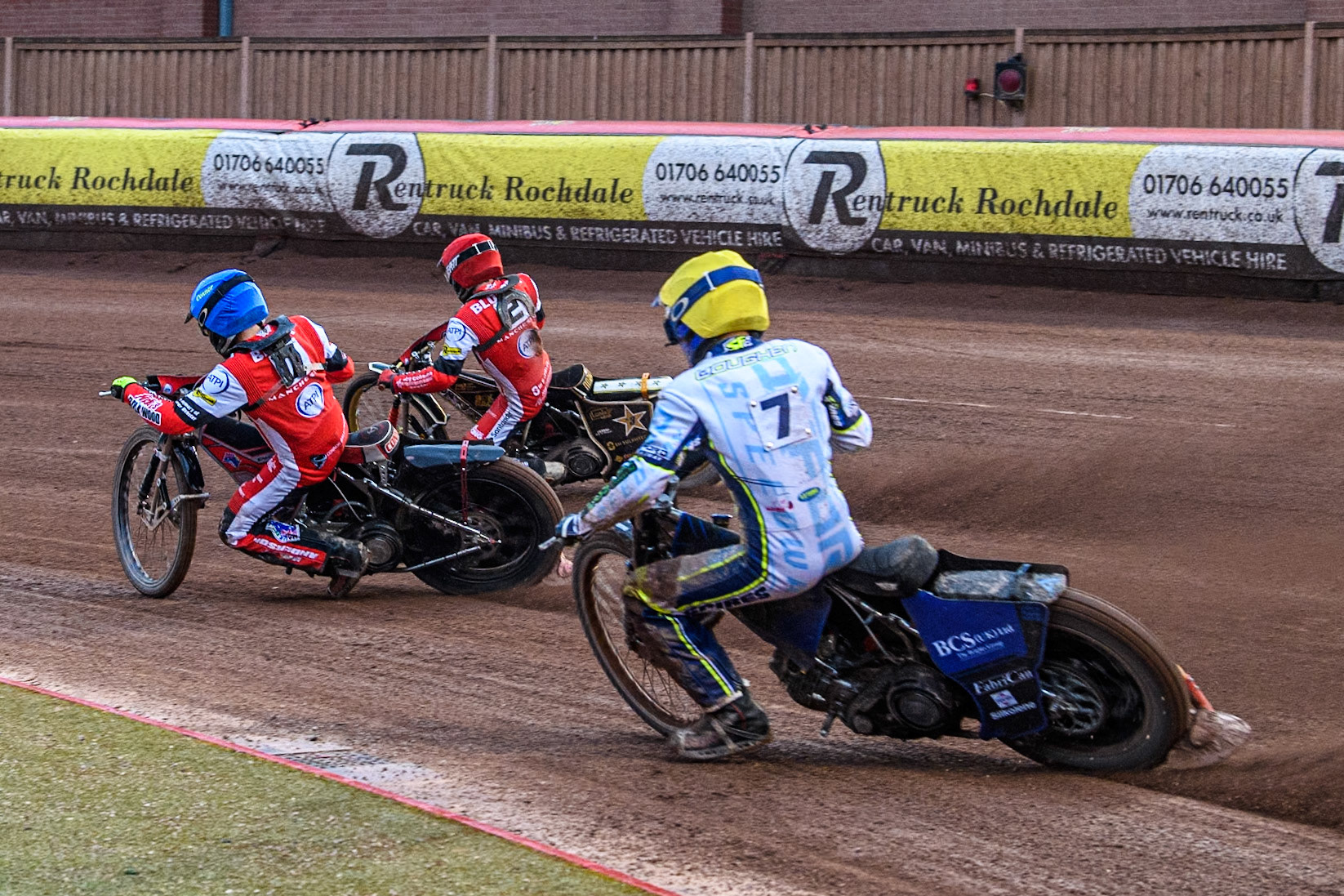 Oxford Spires' Ashton Boughen in Yellow chases Belle Vue Aces' Connor Bailey in Blue and Belle Vue Aces' Norick Blodorn in Red during the Rowe Motor Oil Premiership match between Belle Vue Aces and Oxford Spires at the National Speedway Stadium, Manchester on Monday 13th May 2024. (Photo: Ian Charles | MI News)