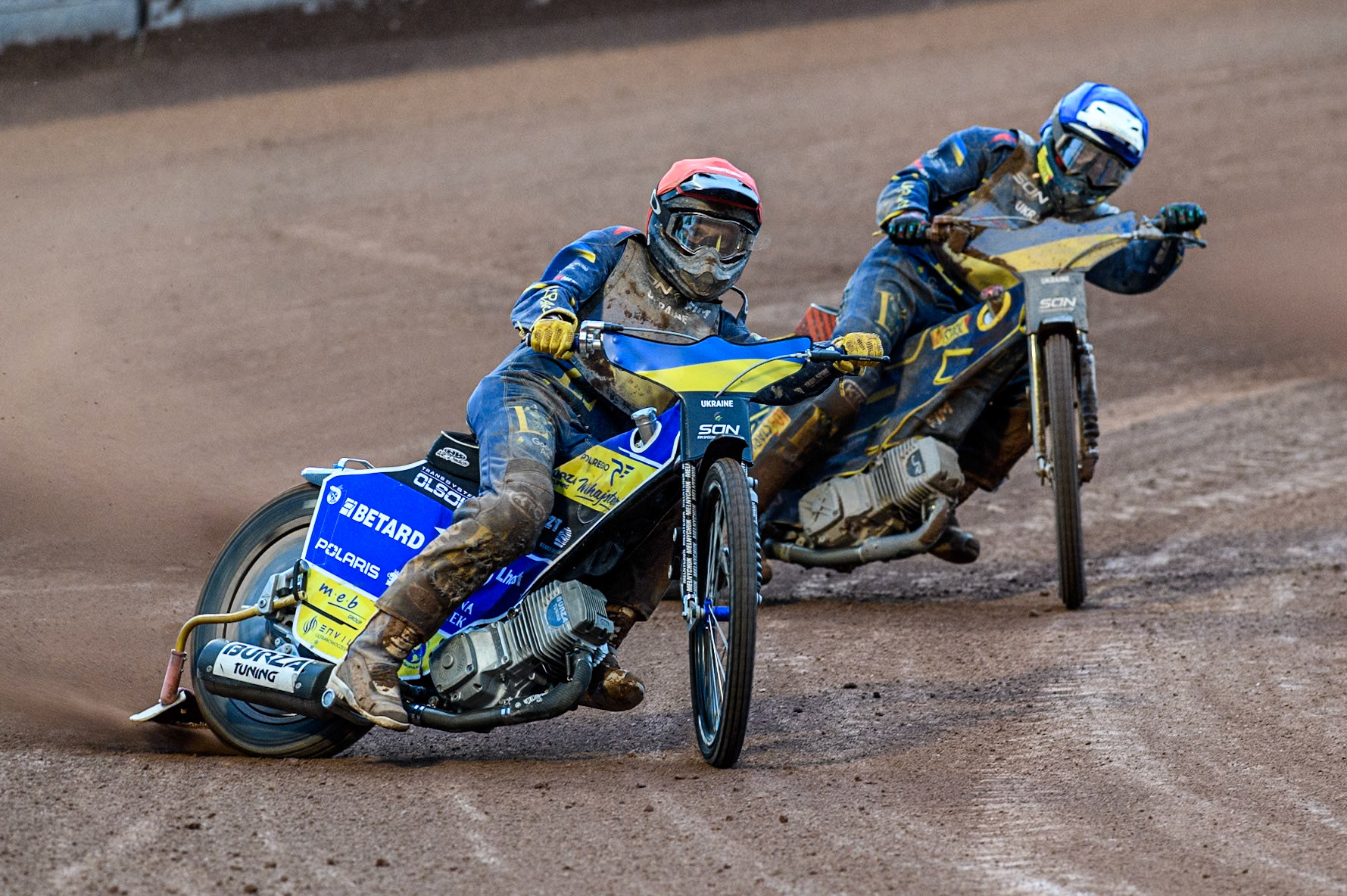 Stanislav Melnychuk of Ukraine in Red leading team mate Marko Levishyn of Ukraine in Blue during the Monster Energy FIM Speedway of Nations Semi-Final 1 at the National Speedway Stadium, Manchester on Tuesday 9th July 2024. (Photo: Ian Charles | MI News)