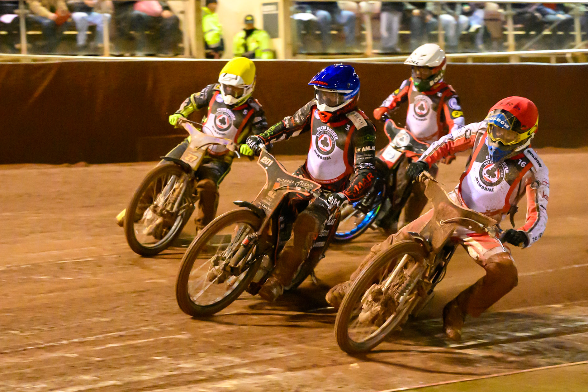 Rasmus Jensen  in Red rides inside Jan Kvech and Tom Brennan in Yellow with Brady Kurtz  in White behind during the Peter Craven Memorial Trophy at the National Speedway Stadium, Manchester, on Monday 16th March 2026. (Photo: Ian Charles | MI News)