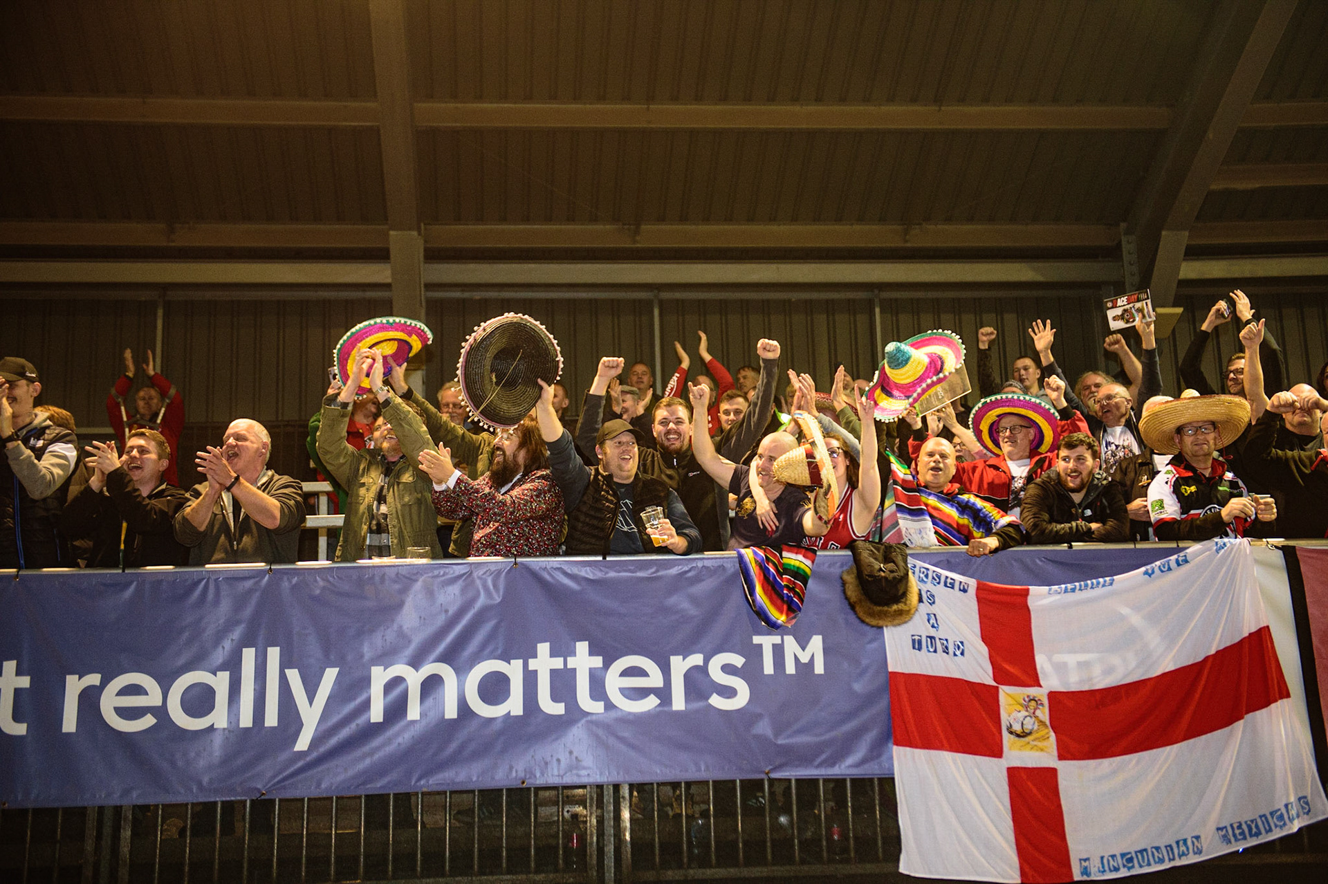 MANCHESTER, UK. OCT 7TH  Belle Vue BikeRight Aces  fans celebrate during the SGB Premiership Play off Semi-Final Second Leg between Belle Vue Aces and Sheffield Tigers at the National Speedway Stadium, Manchester on Thursday 7th October 2021. (Credit: Ian Charles | MI News)