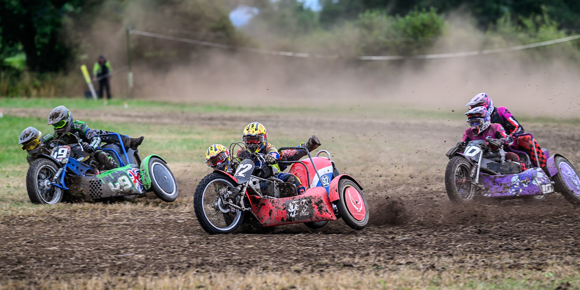Paul Whitlam and Richard Webb (92) leading Billy Winterburn and Bradley Sheils (49) and Clint Blondel and Reece Blondel (10) in the 1000cc Sidecar class during the ACU Northern Grass Track Riders Championship at Cheshire Grass Track Club, Frog Lane, Knutsford, Cheshire on Sunday 20th July 2025. (Photo: Ian Charles | MI News)