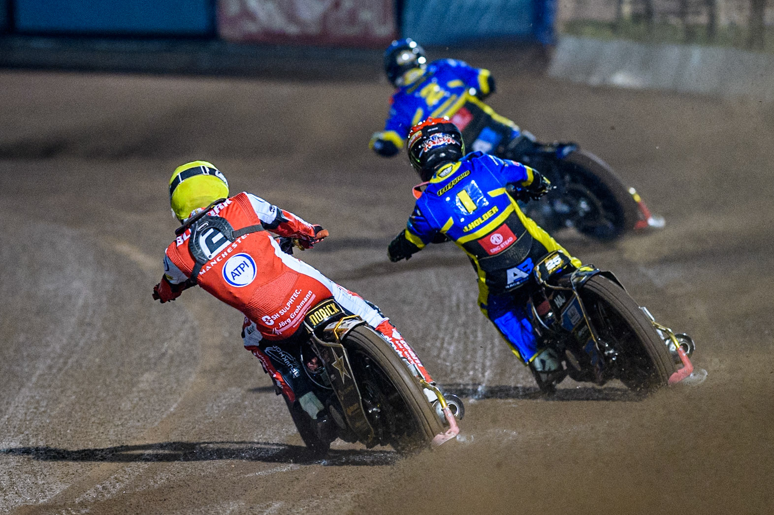 Belle Vue Aces' Norick Blodorn  in Yellow chases Sheffield Tigers' Jack Holder in Red and Sheffield Tigers' Kyle Howarth  in Blue during the Rowe Motor Oil Premiership Play Off Semi Final 2nd leg between Sheffield Tigers and Belle Vue Aces at Owlerton Stadium, Sheffield on Thursday 19th September 2024. (Photo: Ian Charles | MI News)
