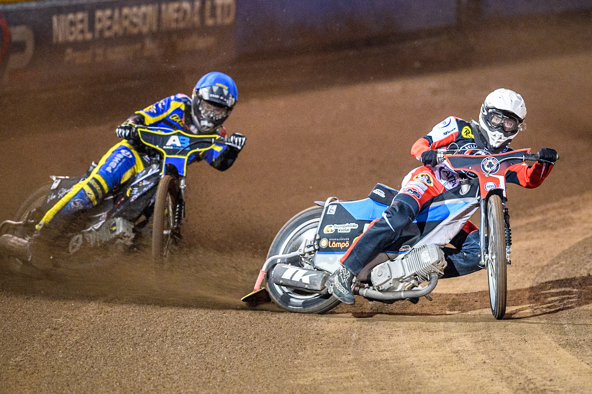 Belle Vue Aces' Antti Vuolas  in White rides inside Sheffield Tigers' Dan Gilkes  in Blue during the Rowe Motor Oil Premiership Play Off Semi Final 2nd leg between Sheffield Tigers and Belle Vue Aces at Owlerton Stadium, Sheffield on Thursday 19th September 2024. (Photo: Ian Charles | MI News)