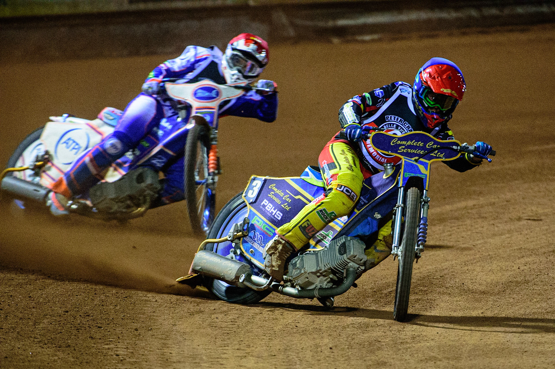 MANCHESTER, UK. OCT 23RD  Kyle Howarth  (Blue) leads Jason Crump  (Red) during the Peter Craven Memorial Trophy event at the National Speedway Stadium, Manchester on Saturday 23rd October 2021. (Credit: Ian Charles | MI News)