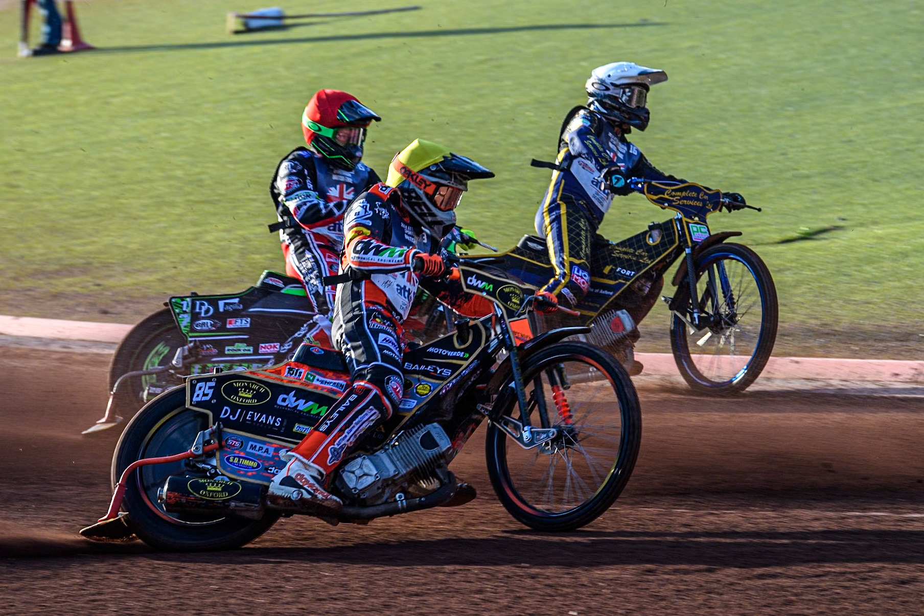 Jordan Jenkins in Yellow rides outside Charles Wright in Red and Kyle Howarth in White during the Attis Insurance Sports Division British Speedway Championship Final at the National Speedway Stadium, Manchester on Saturday 8th June 2024. (Photo: Ian Charles | MI News)