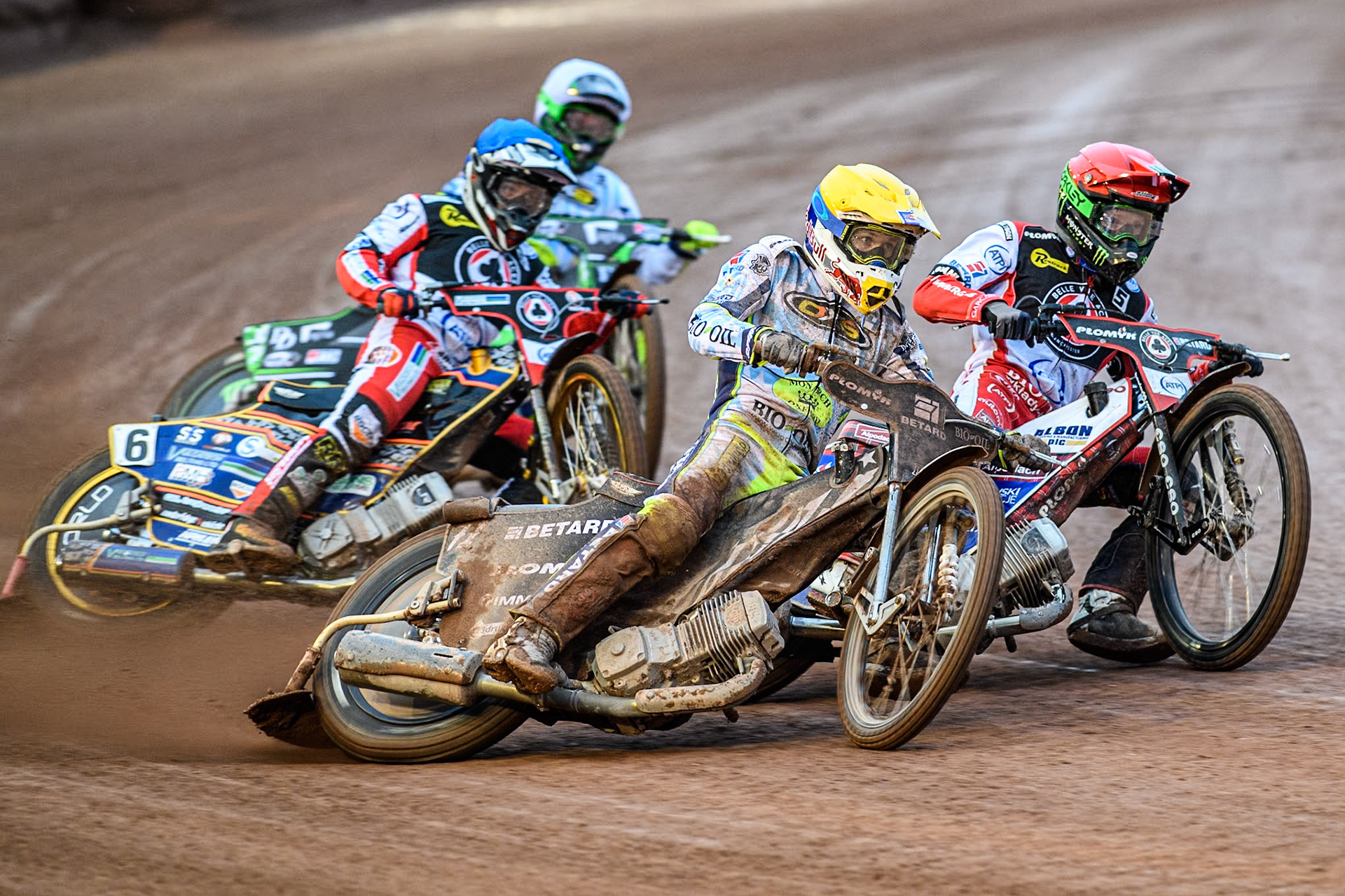 Oxford Spires' Maciej Janowski in Yellow rides outside Belle Vue Aces' Dan Bewley in Red with Belle Vue Aces' Connor Mountain in Blue and Oxford Spires' Charles Wright in White behind during the Rowe Motor Oil Premiership match between Belle Vue Aces and Oxford Spires at the National Speedway Stadium, Manchester on Monday 13th May 2024. (Photo: Ian Charles | MI News)