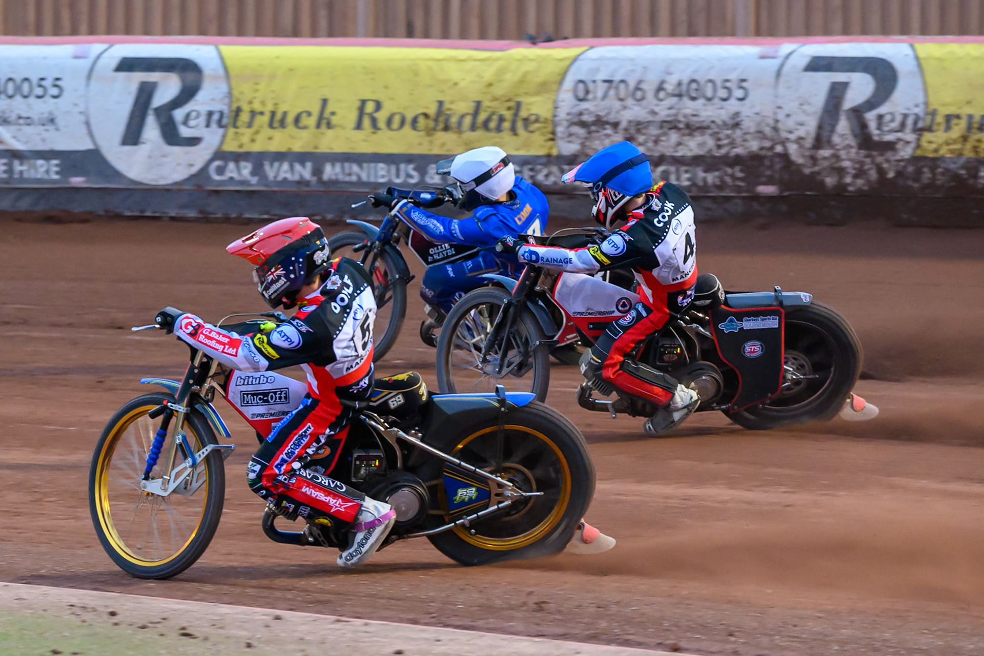 Jason Doyle of Belle Vue Aces in Red andZach Cook of Belle Vue Aces in Blue rides inside Ben Cook of Kings Lynn Stars in White during the Rowe Motor Oil Premiership match between Belle Vue Aces and King's Lynn Stars at the National Speedway Stadium, Manchester on Monday 29th June 2026. (Photo: Ian Charles | MI News)