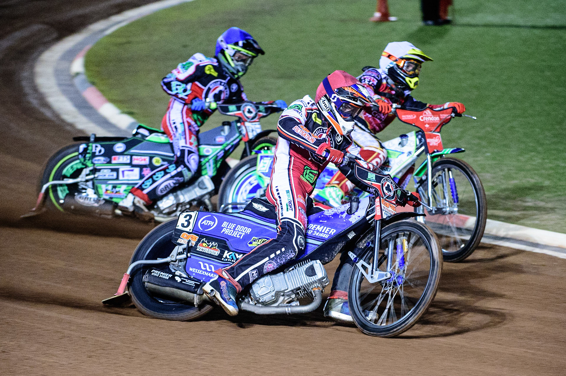 MANCHESTER, UK. OCT 11TH  Steve Worrall  (Red) outside Hans Andersen (White) with Charles Wright  (Blue) behind during the SGB Premiership Grand Final 1st Leg between Belle Vue Aces and Peterborough Panthers at the National Speedway Stadium, Manchester on Monday 11th October 2021. (Credit: Ian Charles | MI News)