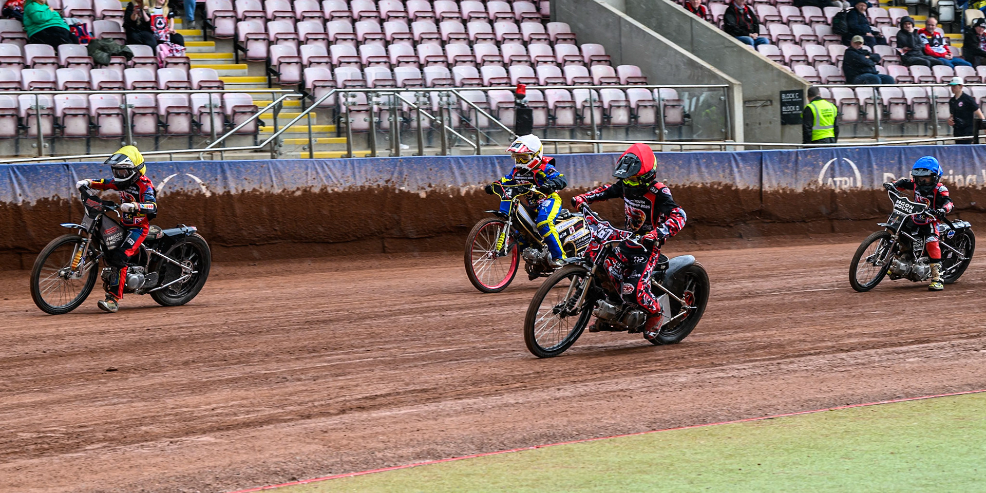 125cc Class: Charlie Fletcher (123) in Yellow Charlie Luckman (367) in Red, Archie Whitelam (92) in White and Douglas Marshall (99) in Blue during the British Youth Championship (125cc) Round 2A, at the National Speedway Stadium, Manchester on Sunday 1st June 2025. (Photo: Ian Charles | MI News)