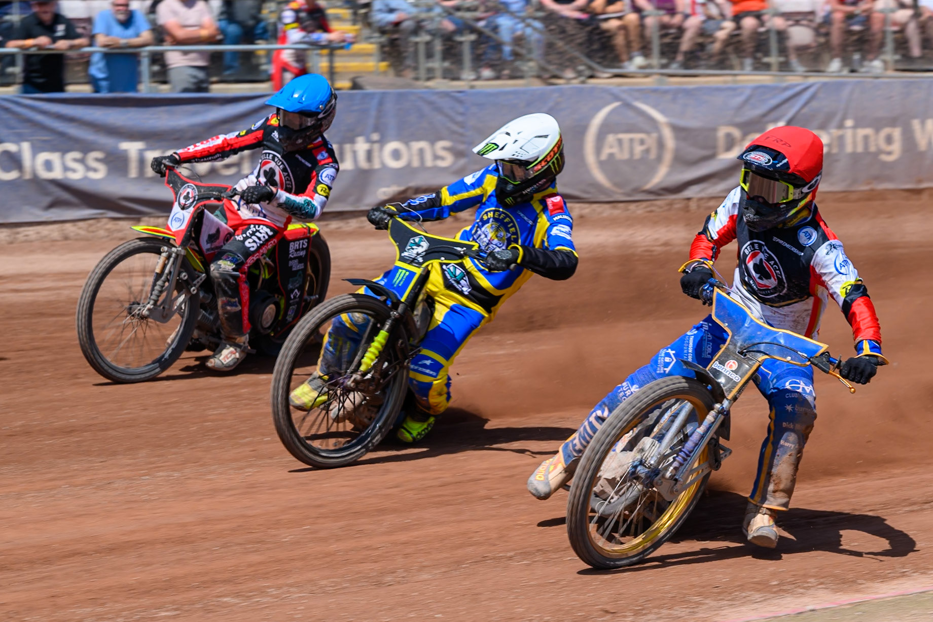 Justin Sedgman, Guest Rider for Belle Vue Aces in Red rides inside Chris Holder of Sheffield Tigers in White and Tate Zischke of Belle Vue Aces in Blue during the Rowe Motor Oil Premiership match between Belle Vue Aces and Sheffield Tigers at the National Speedway Stadium, Manchester on Monday 25th May 2026. (Photo: Ian Charles | MI News)