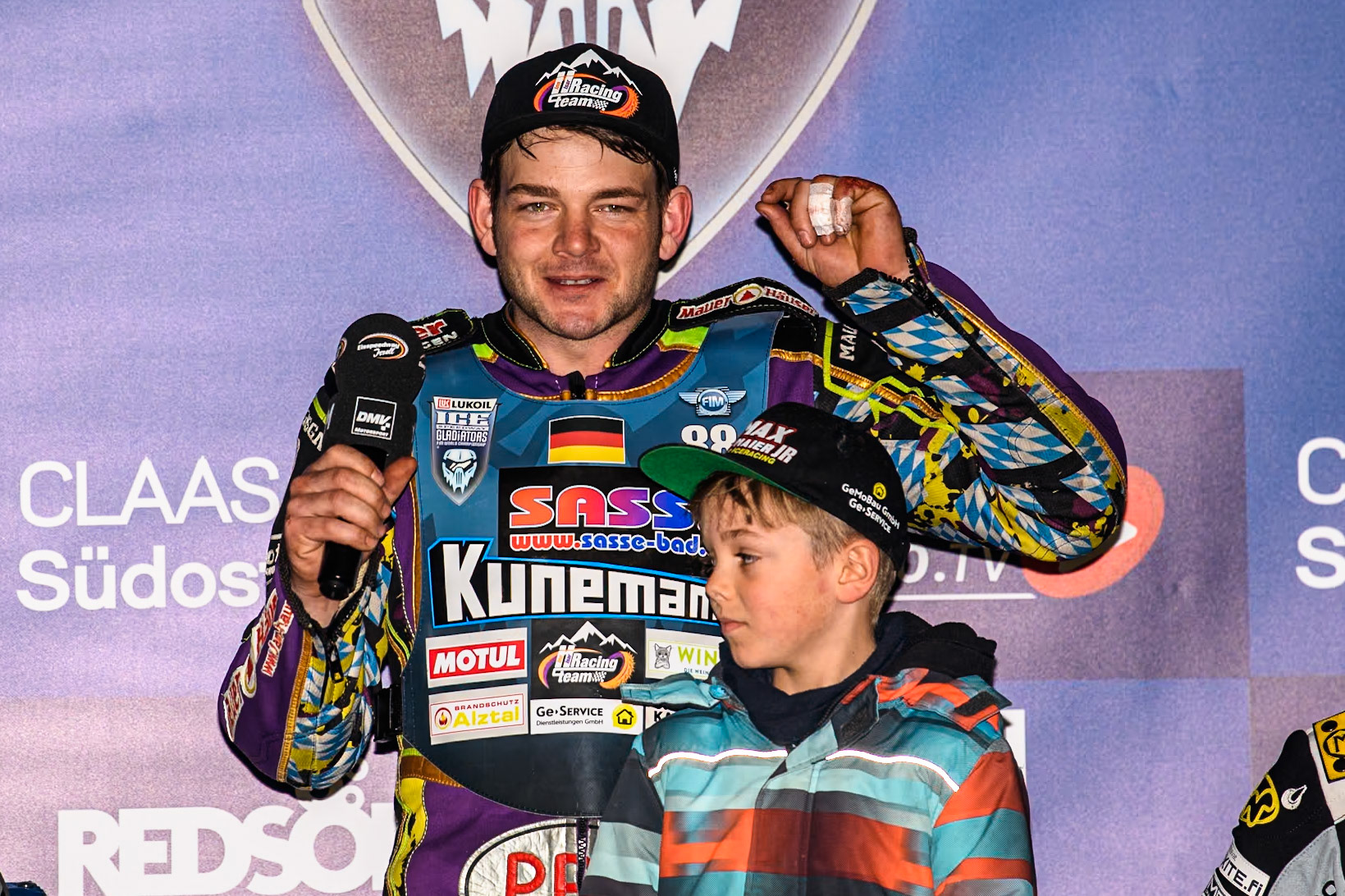 Germany's Max Niedermaier (88) thanks the crowd and his sponsors for their support after his win during the FIM Ice Speedway Gladiators World Championship Final 1 at the Max-Aicher-Arena, Inzell on Saturday 23 March 2024. (Photo: Ian Charles | MI News)