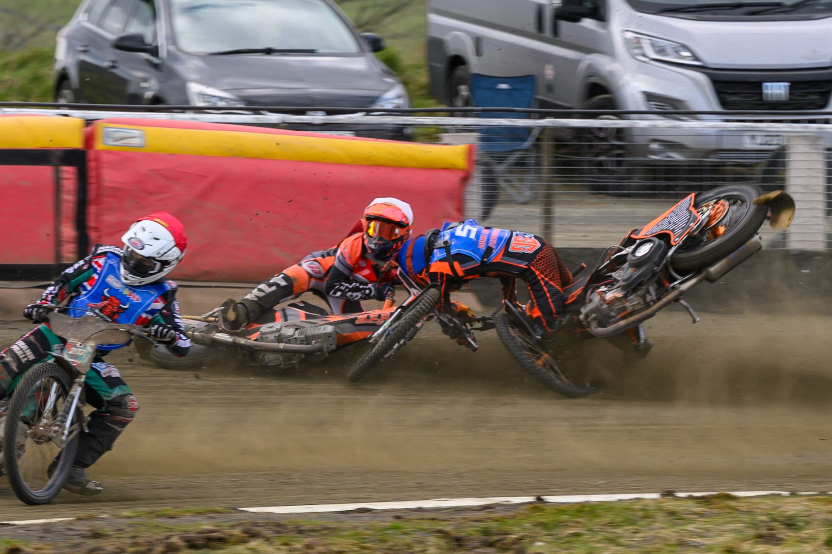 Connor Coles of NDL Nomads   in White fall and Jack Smith of Buxton Bulls   in Blue collides with him during the  Challenge match between Buxton Bulls and NDL Nomads at Hi-Edge Speedway, Buxton on Sunday 19th April 2026. (Photo: Ian Charles | MI News)