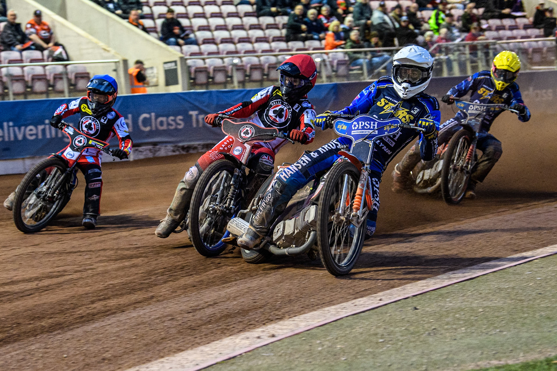 King Lynn Stars' Niels-Kristian Iversen in White rides inside Belle Vue Aces' Brady Kurtz in Red and Belle Vue Aces' Ben Cook in Blue with King Lynn Stars' Patryk Wojdylo in Yellow behind during the Rowe Motor Oil Premiership match between Belle Vue Aces and King's Lynn Stars at the National Speedway Stadium, Manchester on Monday 20th May 2024. (Photo: Ian Charles | MI News)