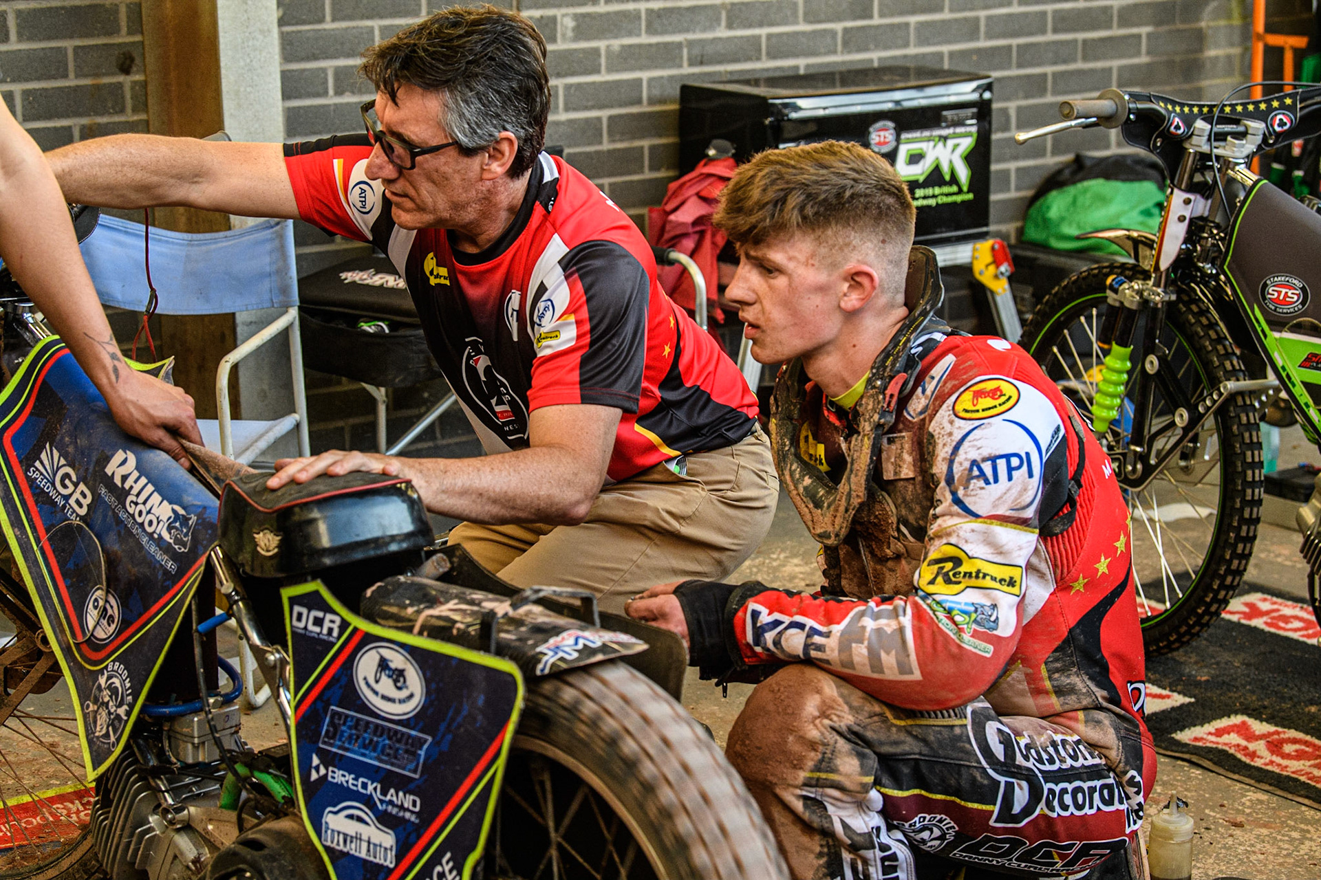 Belle Vue ATPI Aces Team Manager Mark Lemon leads assists Jake Mulford during the Sports Insure Premiership match between Belle Vue Aces and Ipswich Witches at the National Speedway Stadium, Manchester on Monday 5th June 2023. (Photo: Ian Charles | MI News)