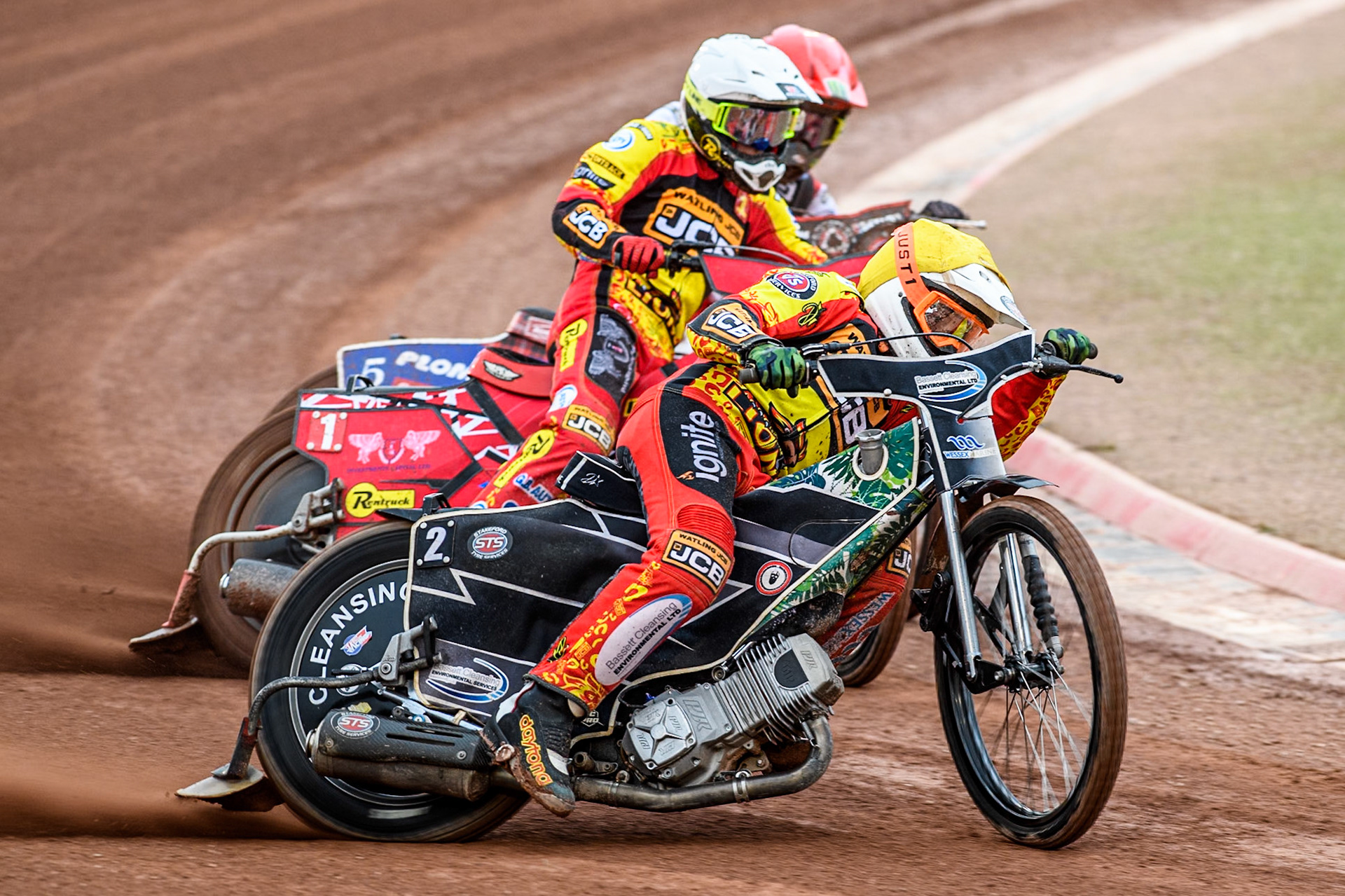 Leicester Lions' Richard Lawson in Yellow rides outside Leicester Lions' Max Fricke in White and Belle Vue Aces' Dan Bewley in Red during the Rowe Motor Oil Premiership match between Belle Vue Aces and Leicester Lions at the National Speedway Stadium, Manchester on Monday 24th June 2024. (Photo: Ian Charles | MI News)