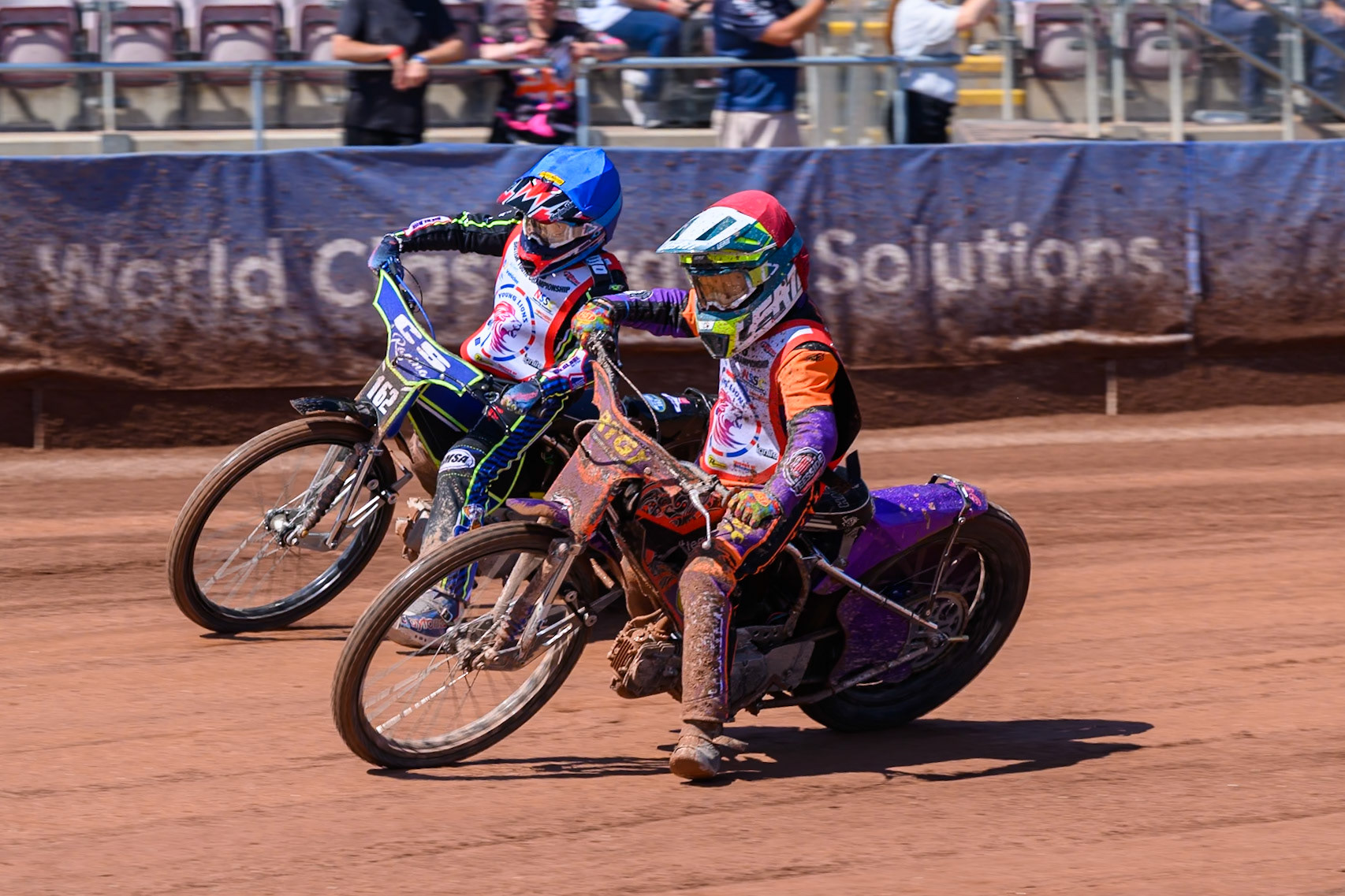 125cc SUPPORT CLASS Seb Kelly (57) in Red rides inside Cody Smith (162) in Blue during the British Youth Championship (125cc) at the National Speedway Stadium, Manchester on Sunday 19th July 2026. (Photo: Ian Charles | MI News)