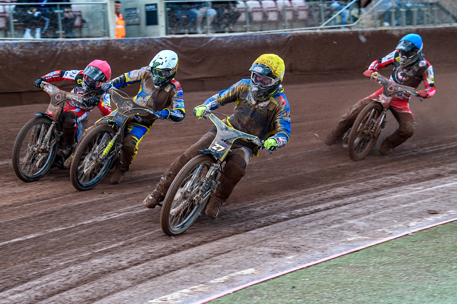 Sheffield Tigers' Guest rider Tom Brennan in Yellow leading Chris Holder in White, Belle Vue Aces' Ben Cook in Red and Belle Vue Aces' Norick Blodorn in Blue during the Rowe Motor Oil Premiership match between Belle Vue Aces and Sheffield Tigers at the National Speedway Stadium, Manchester on Monday 27th May 2024. (Photo: Ian Charles | MI News)
