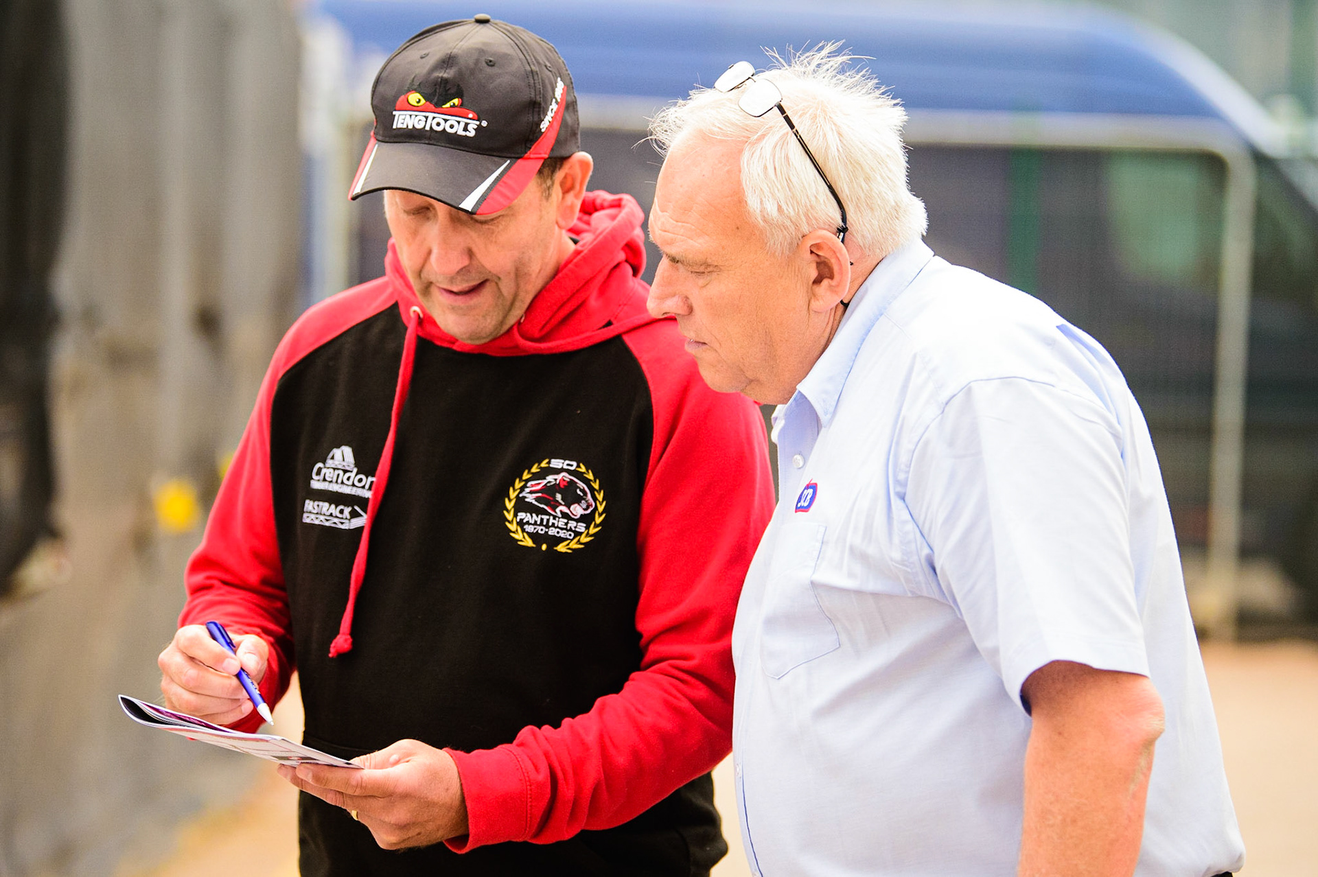 Rob Lyon, Team Manager of Peterborough Crendon Panthers (left) with match Referee Chris Durno during the SGB Premiership match between Belle Vue Aces and Peterborough at the National Speedway Stadium, Manchester on Monday 25th July 2022. (Credit: Ian Charles | MI News