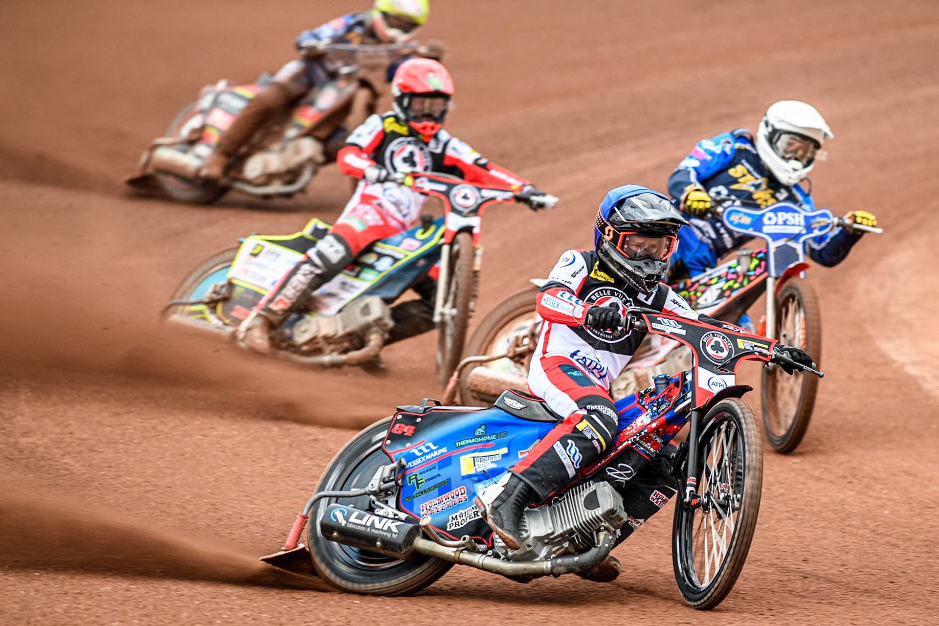 Belle Vue Aces' Ben Cook in Blue and Belle Vue Aces' Jaimon Lidsey in Red leading King Lynn Stars' Niels-Kristian Iversen in White and King Lynn Stars' Michael Palm Toft in Yellow during the Rowe Motor Oil Premiership match between Belle Vue Aces and King's Lynn Stars at the National Speedway Stadium, Manchester on Monday 20th May 2024. (Photo: Ian Charles | MI News)
