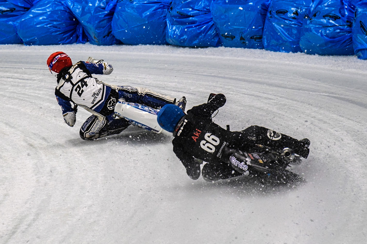 Aki Ala-Riihimäki (66) of Finland in Blue chases Max Koivula (24) of Finland in Red during the Ice Speedway Gladiators World Championship Final 1 at Max-Aicher-Arena, Inzell on Saturday 15th March 2025. (Photo: Ian Charles | MI News)