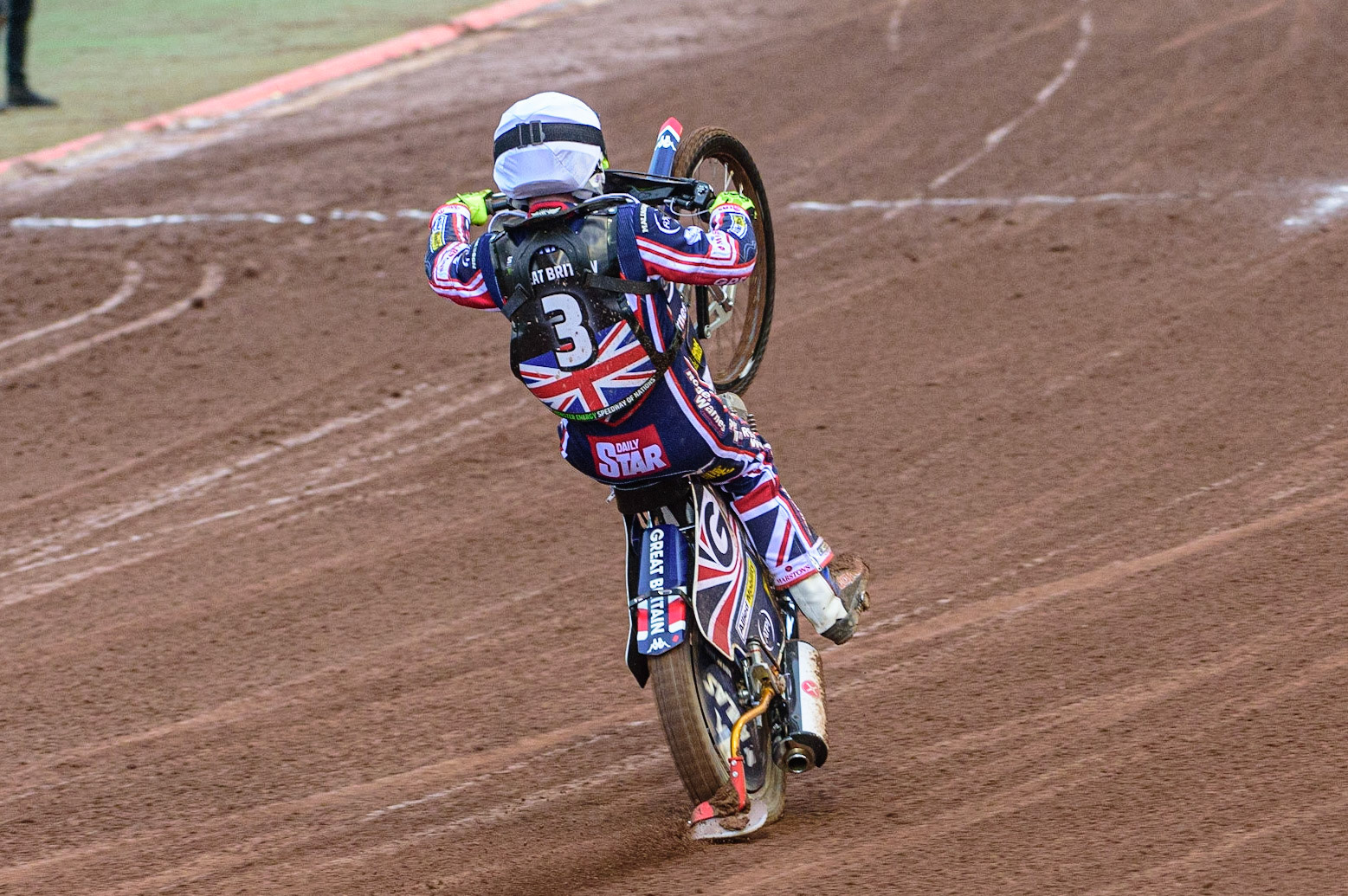 MANCHESTER, UK. OCT 17TH Tom Brennan of Great Britain celebrates with a wheelie during the Monster Energy FIM Speedway of Nations at the National Speedway Stadium, Manchester on Sunday  17th October 2021. (Credit: Ian Charles | MI News)