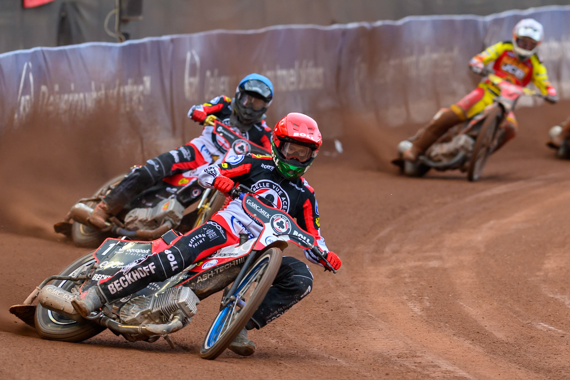 Brady Kurtz of Belle Vue Aces in Red leading Norick Blödorn of Belle Vue Aces in Blue and Sam Masters of Leicester Lions in White during the Rowe Motor Oil Premiership match between Belle Vue Aces and Leicester Lions at the National Speedway Stadium, Manchester on Monday 15th June 2026. (Photo: Ian Charles | MI News)