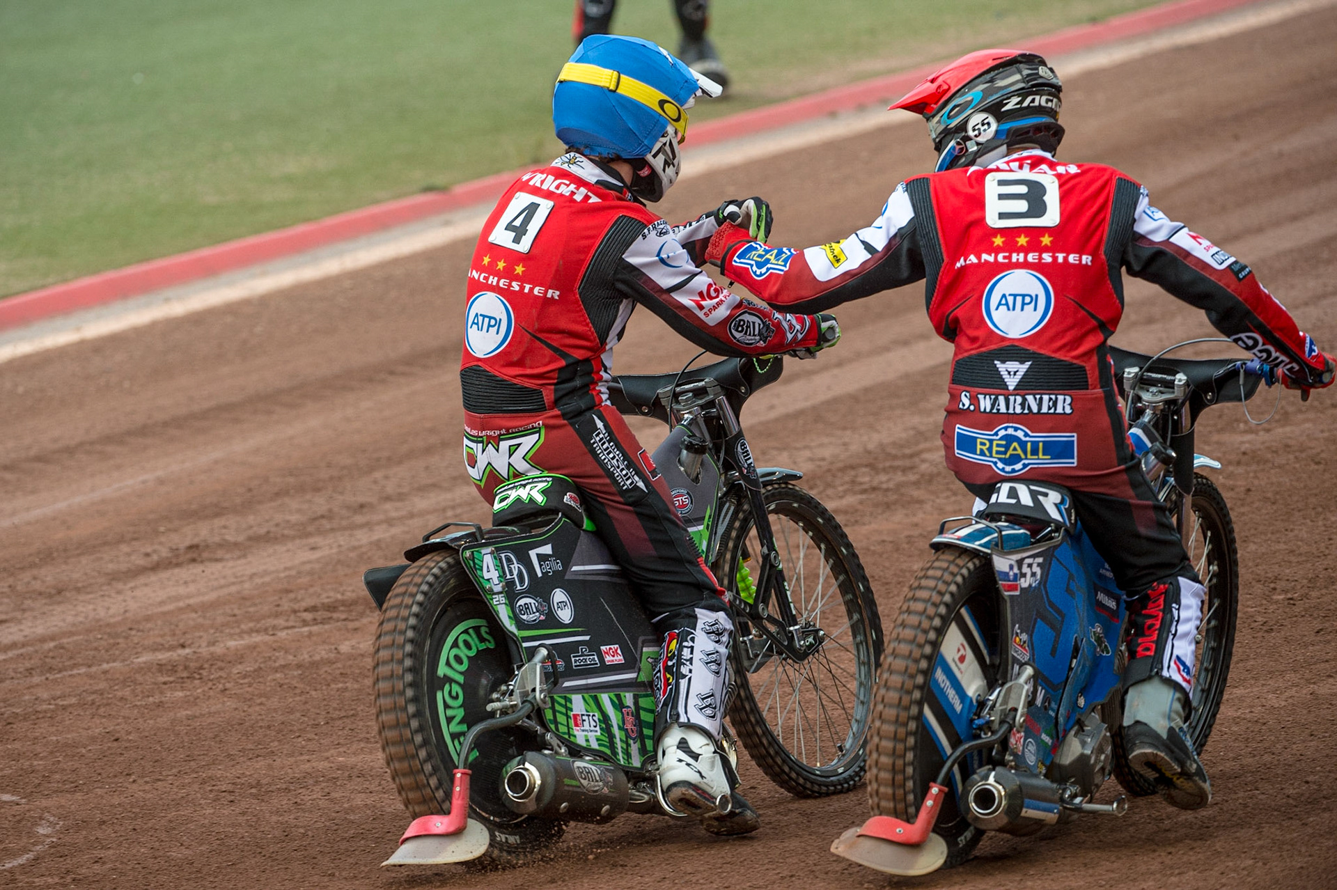 MANCHESTER, UK. JUN 13TH Charles Wright  (Blue) and Matej Zagar  congratulate each other on their maximum heat win during the SGB Premiership match between Belle Vue Aces and Wolverhampton  Wolves at the National Speedway Stadium, Manchester on Monday 13th June 2022. (Credit: Ian Charles | MI News)