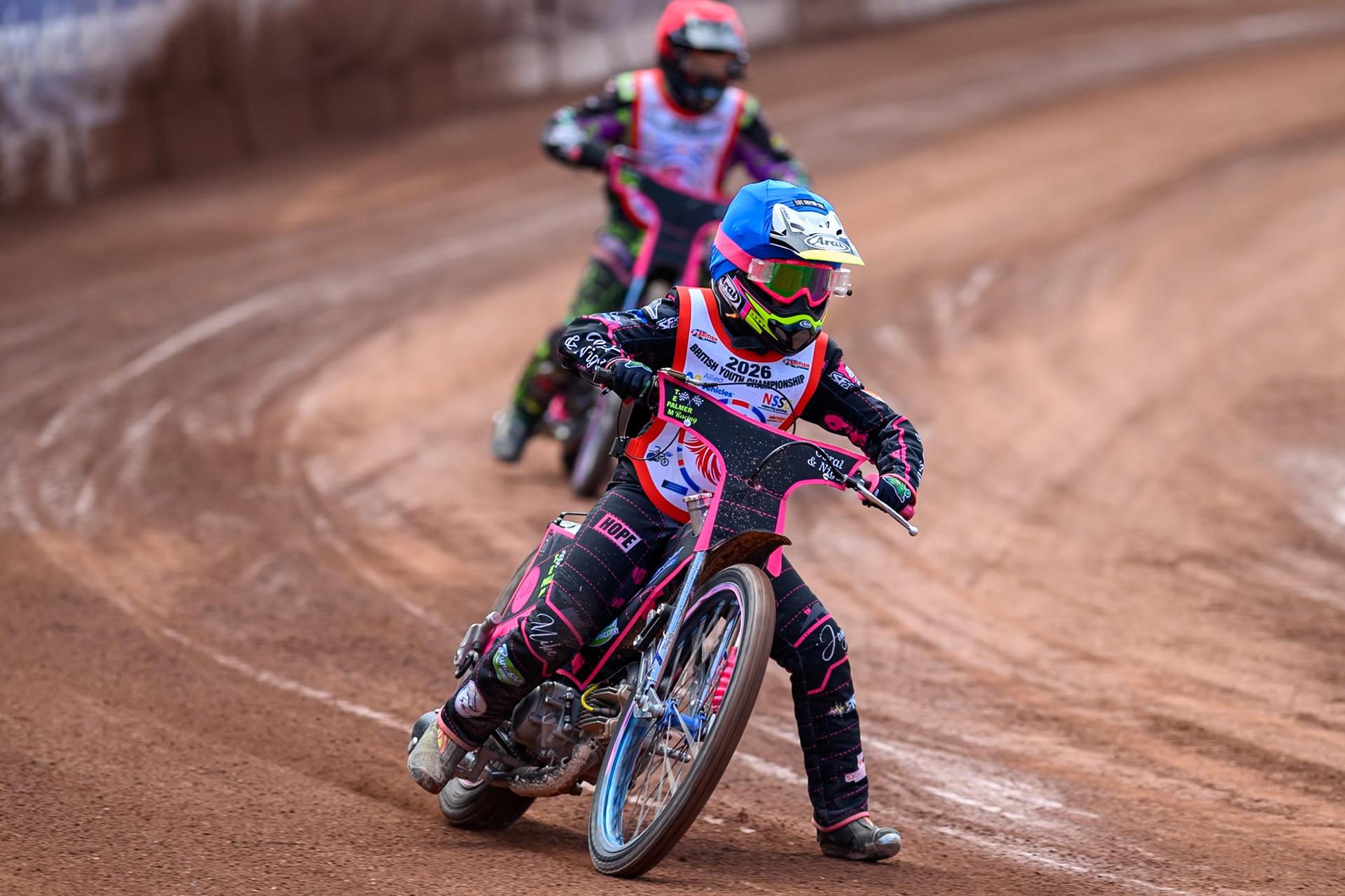 125cc SUPPORT CLASS Jessica Cox (61) in Blue leading John Cox (13) in Red during the British Youth Championship (125cc) at the National Speedway Stadium, Manchester on Sunday 19th July 2026. (Photo: Ian Charles | MI News)