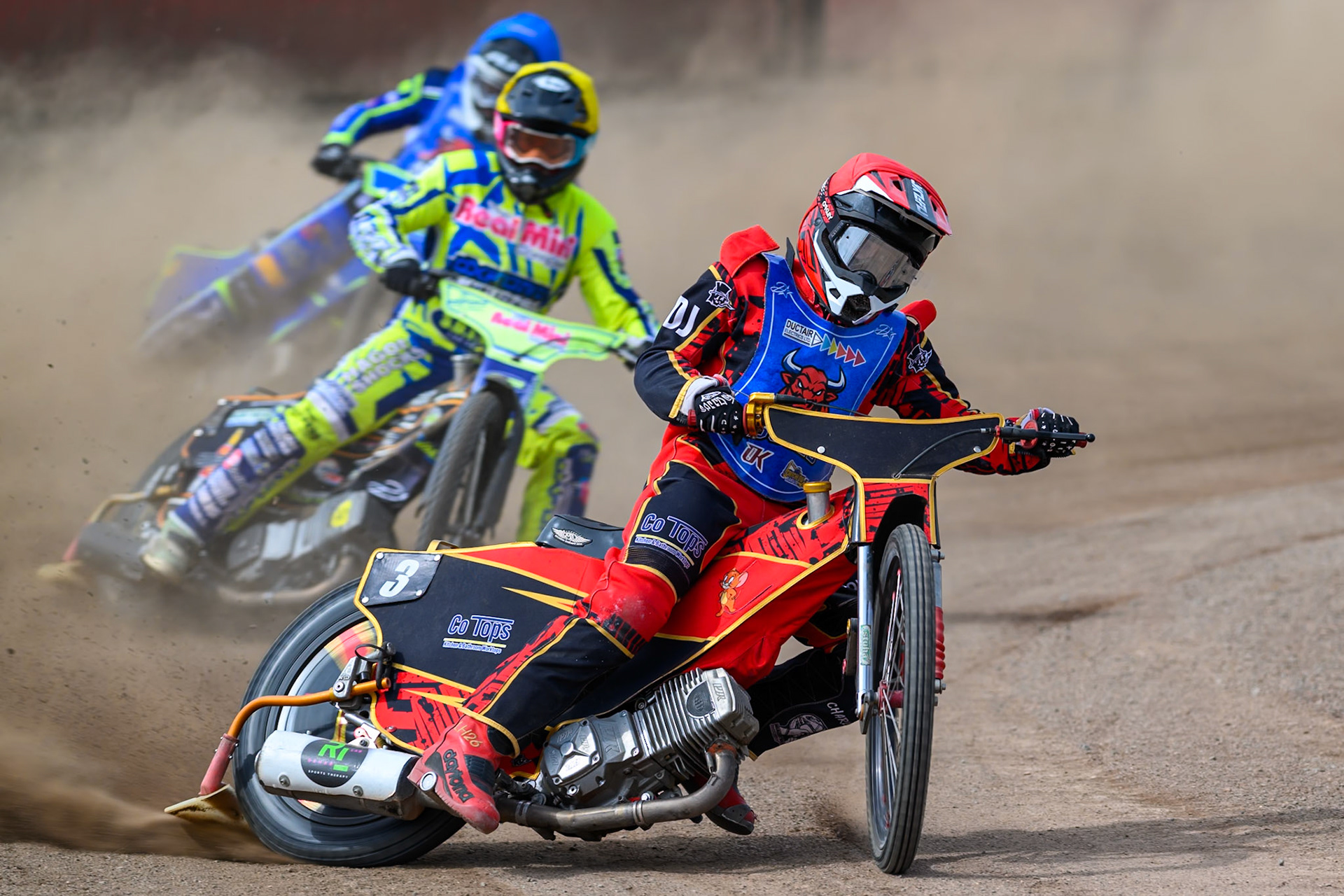 Luke Harris of Buxton Bulls in Red leading Ashton Vale of Oxford Chargers in Yellow  and Arran Butcher of Buxton Bulls in Blue during the WSRA National Development League match between Buxton Bulls and Oxford Chargers at Hi-Edge Speedway, Buxton on Sunday 2nd August 2026. (Photo: Ian Charles | MI News)