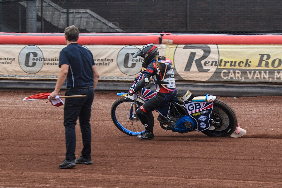 Julie Harding is encouraged by Instructor Phil Morris to ride wide on the bends during the FIM Women's  Speedway Academy at the National Speedway Stadium, Manchester on Friday 4th August 2023. (Photo: Ian Charles | MI News)