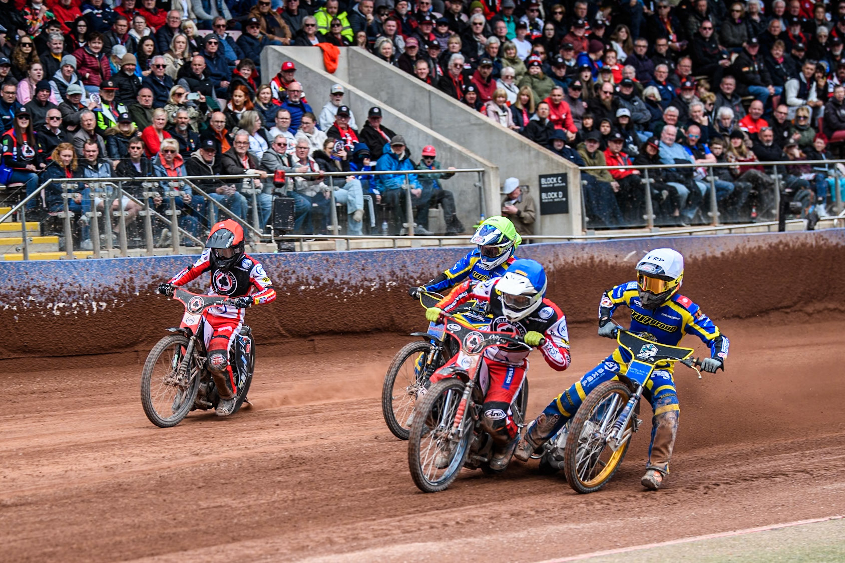 Jake Mulford of Belle Vue Aces in Blue rides leading Justin Sedgmen of Sheffield Tigers in White, Leon Flint of Sheffield Tigers in Yellow and Zach Cook of Belle Vue Aces in Red during the Rowe Motor Oil Premiership match between Belle Vue Aces and Sheffield Tigers at the National Speedway Stadium, Manchester on Monday 5th May 2025. (Photo: Ian Charles | MI News)