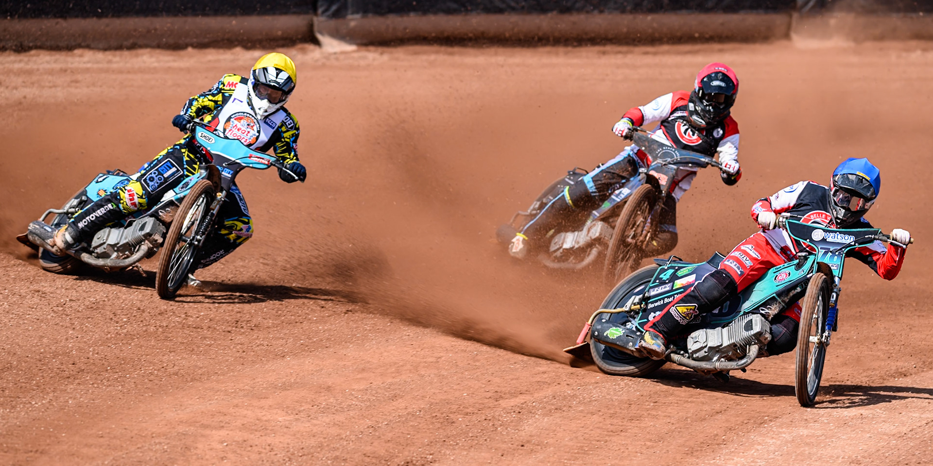 Mason Watson of Belle Vue Colts  in Blue rides inside Jamie Halder of Middlesborough Tigers  in Yellow with Jack Kingston of Belle Vue Colts  in Red behind during the WSRA National Development League match between Belle Vue Colts and Middlesbrough Tigers at the National Speedway Stadium, Manchester on Sunday 10th August 2025. (Photo: Mark Fletcher | MI News)