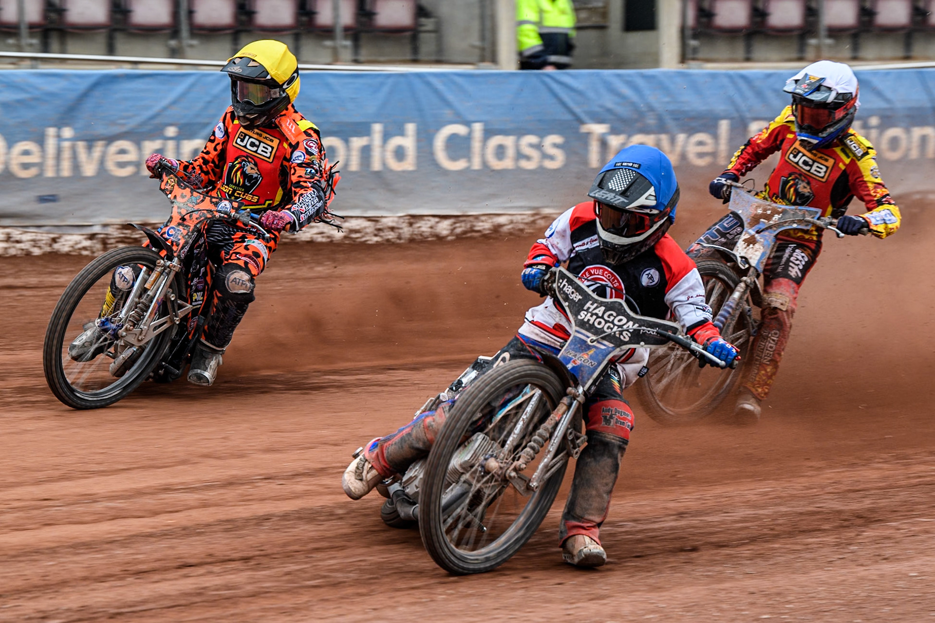 Belle Vue Colts' Harry Fletcher in Blue leading Leicester Lion Cubs' Cooper Rushen in Yellow and Leicester Lion Cubs' Sonny Springer in White Belle Vue Colts' Harry Fletcher in Blue leading Leicester Lion Cubs' Cooper Rushen in Yellow and Leicester Lion Cubs' Sonny Springer in White during the WSRA National Development League match between Belle Vue Colts and Leicester Lion Cubs at the National Speedway Stadium, Manchester on Friday 18th April 2025. (Photo: Ian Charles | MI News)
