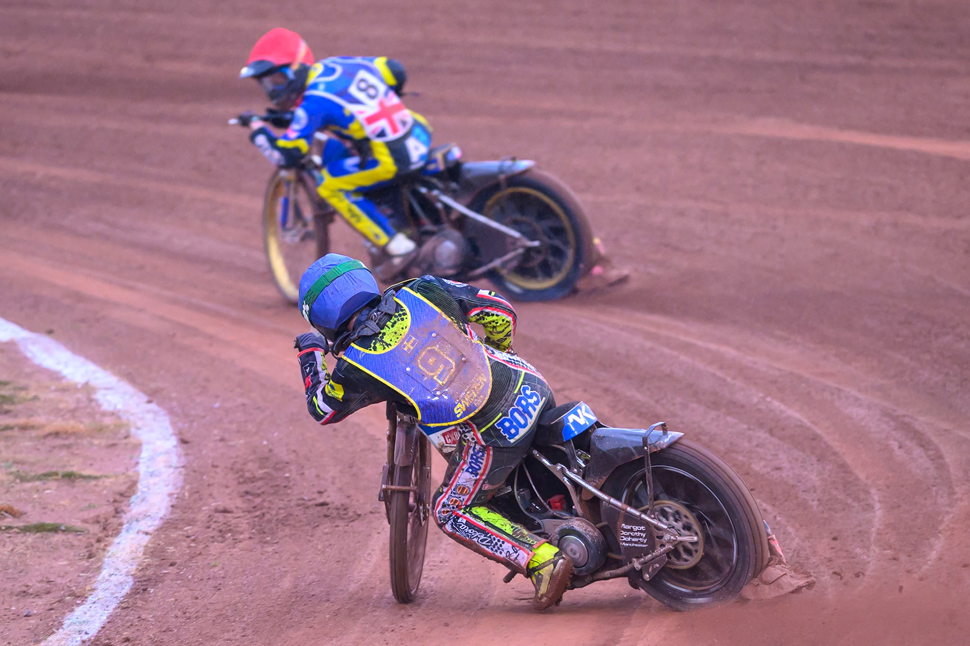 Casper Henriksson of Sweden in Blue chases Anders Rowe of Great Britain in Red during the Speedway GP Qualifying Round 3 at Allied Ashfield Stadium, Glasgow on Saturday 30th May 2026. (Photo: Ian Charles | MI News)