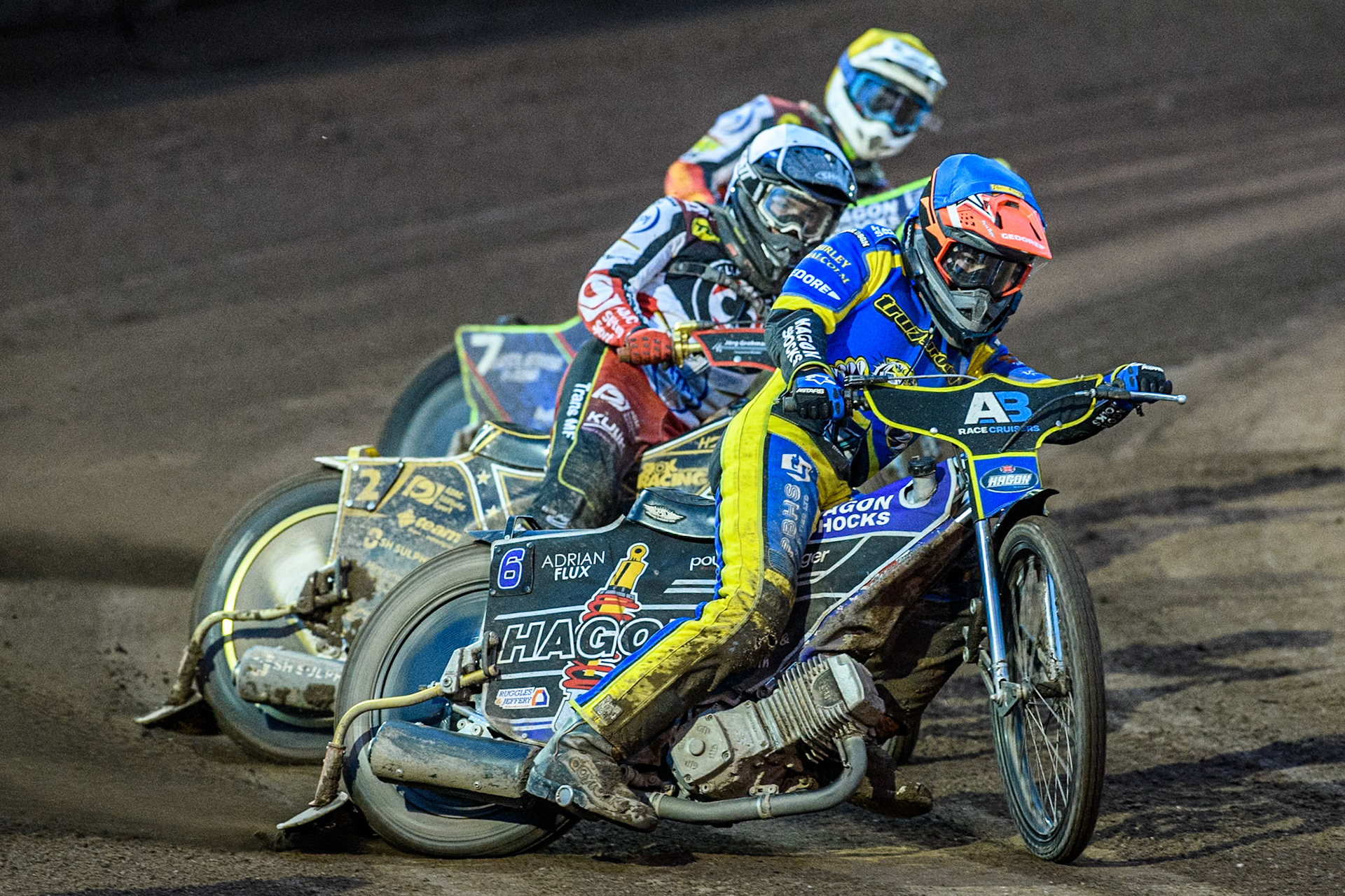 Sheffield Tigers' Jason Edwards  in Blue leading Belle Vue Aces' Norick Blödorn  in White and Belle Vue Aces' Jake Mulford  in Yellow during the Rowe Motor Oil Premiership match between Sheffield Tigers and Belle Vue Aces at Owlerton Stadium, Sheffield on Monday 26th August 2024. (Photo: Ian Charles | MI News)