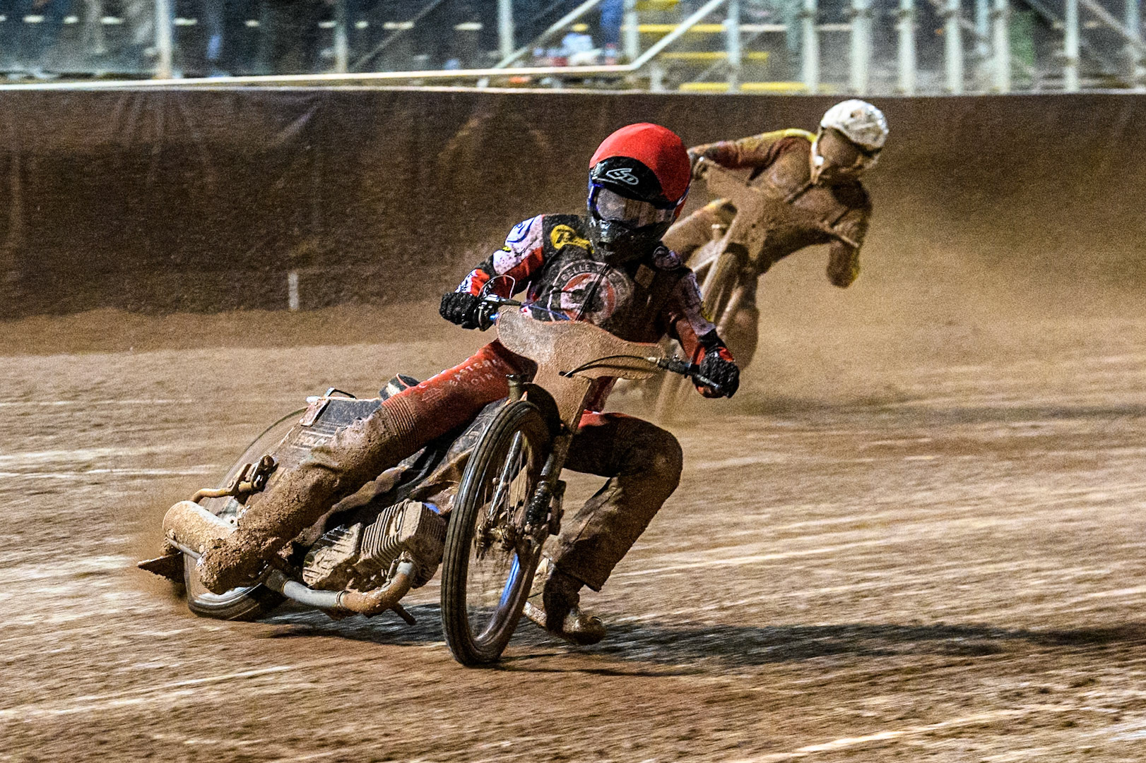 Belle Vue Aces' Brady Kurtz  in Red leading Leicester Lions' Ryan Douglas  in White during the Rowe Motor Oil Premiership Grand Final 1st Leg between Belle Vue Aces and Leicester Lions at the National Speedway Stadium, Manchester on Monday 23rd September 2024. (Photo: Ian Charles | MI News)