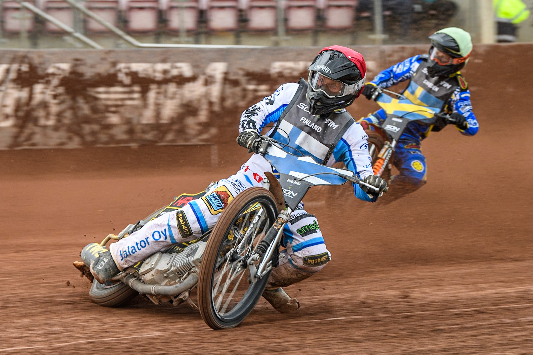 Jesse Mustonen of Finland in Red leading Jacob Thorssell of Sweden in Yellow during the Monster Energy FIM Speedway of Nations Semi-Final 1 at the National Speedway Stadium, Manchester on Tuesday 9th July 2024. (Photo: Ian Charles | MI News)